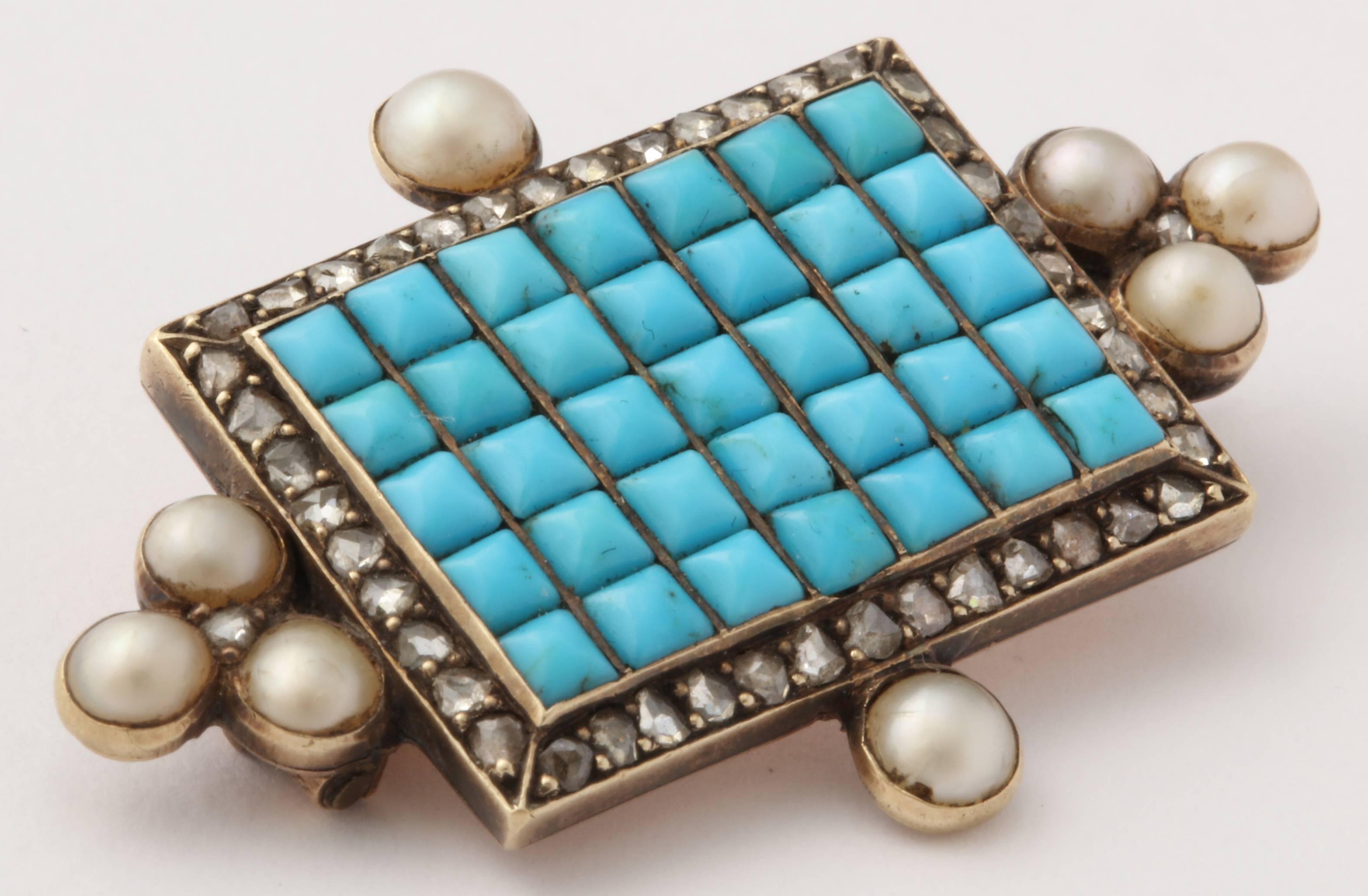 Perfectly matched Persian turquoise is set in the central rectangle surround by a row of rose cut diamonds. 8 natural pearls are set around the diamonds. Exquisite condition and a charming example of the quality of craftsmanship in the Victorian