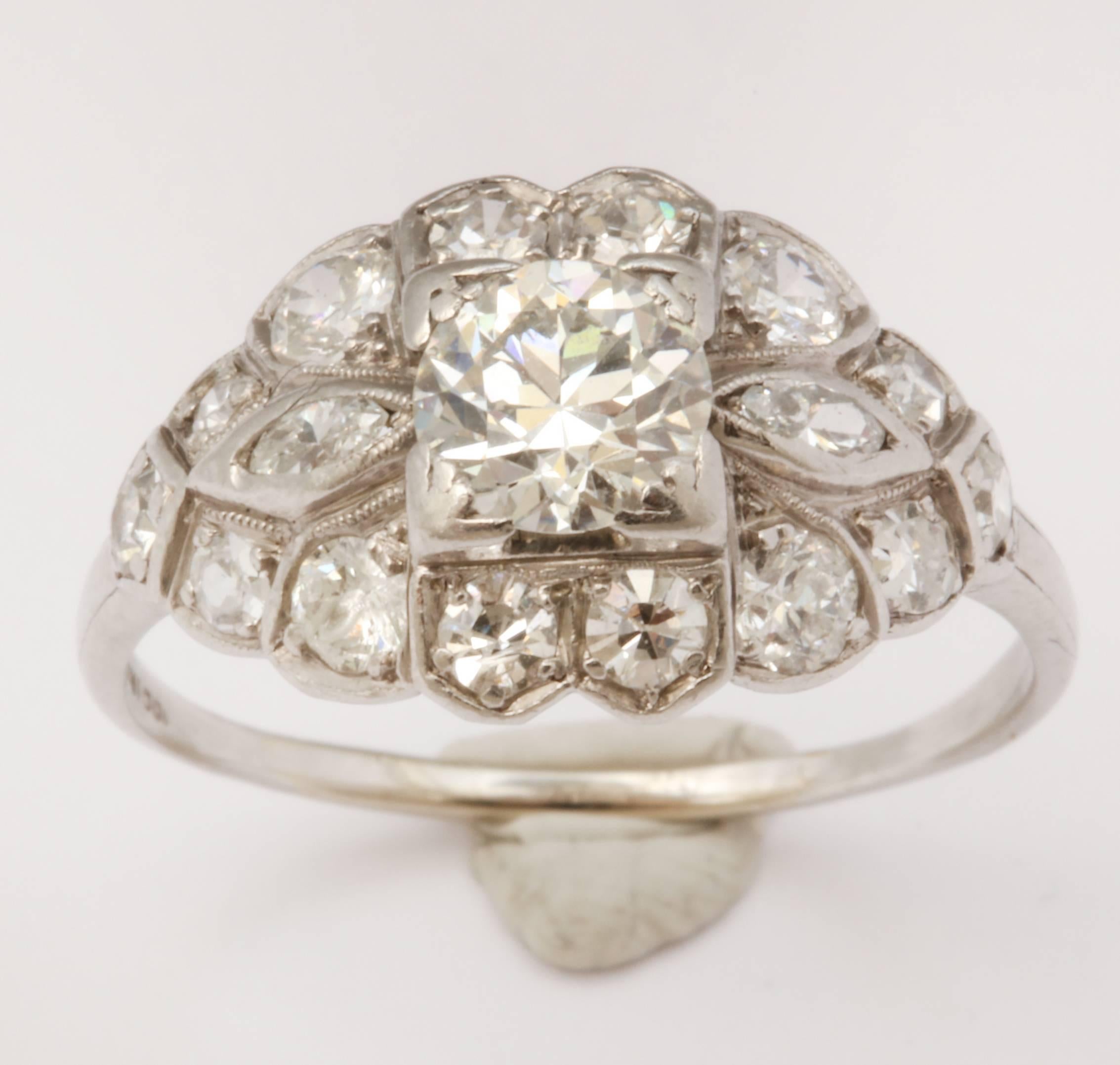 Beautiful navette shaped Art Deco engagement ring. The ring is platinum with .70ct Old European cut center stone. The center stone is prong set and surrounded by 16 Old European cut stones. EGL certified: G-H, VS2. 