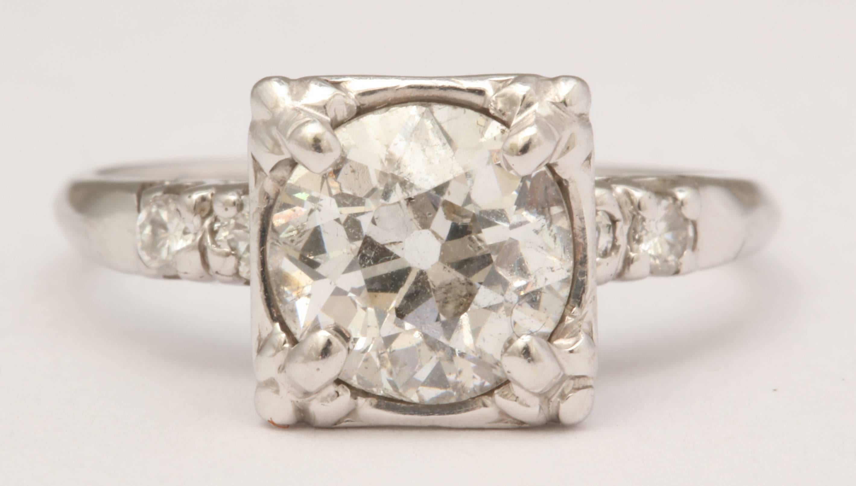 14K white gold and diamond 1930's engagement ring with a 1.50ct Old European Cut center stone set in a square shaped head. 2 single cuts are set into each shoulder. EGL certified: G-H, SI3. Although the center diamond has a low clarity, to the naked