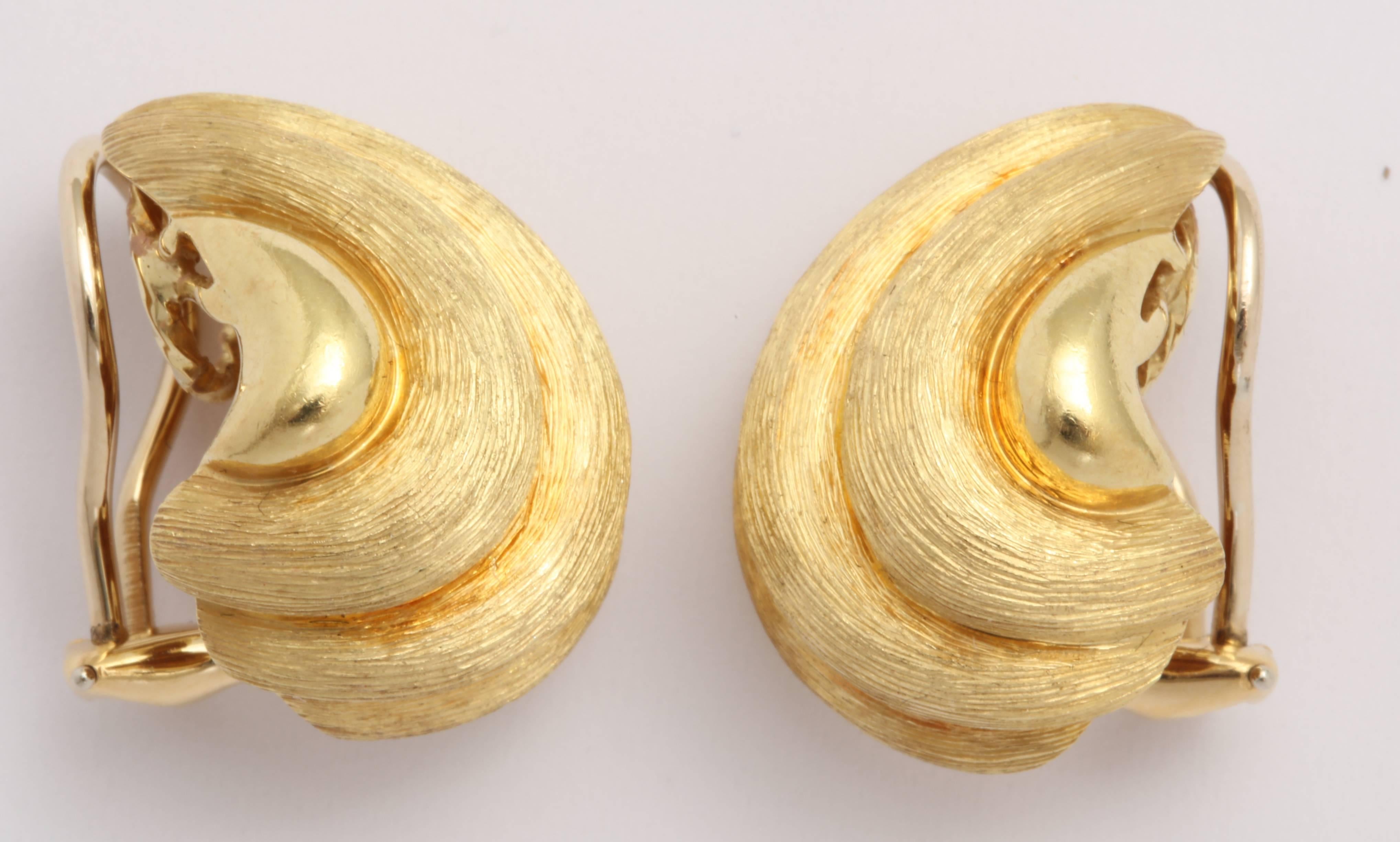 Pair of signed and numbered Henry Dunay  classically inspired clip on Earrings.  Beautiful engraved & polished finish.   They can be converted to pierced and now have a classic Omega back.
   Very smart - chic and wearable.