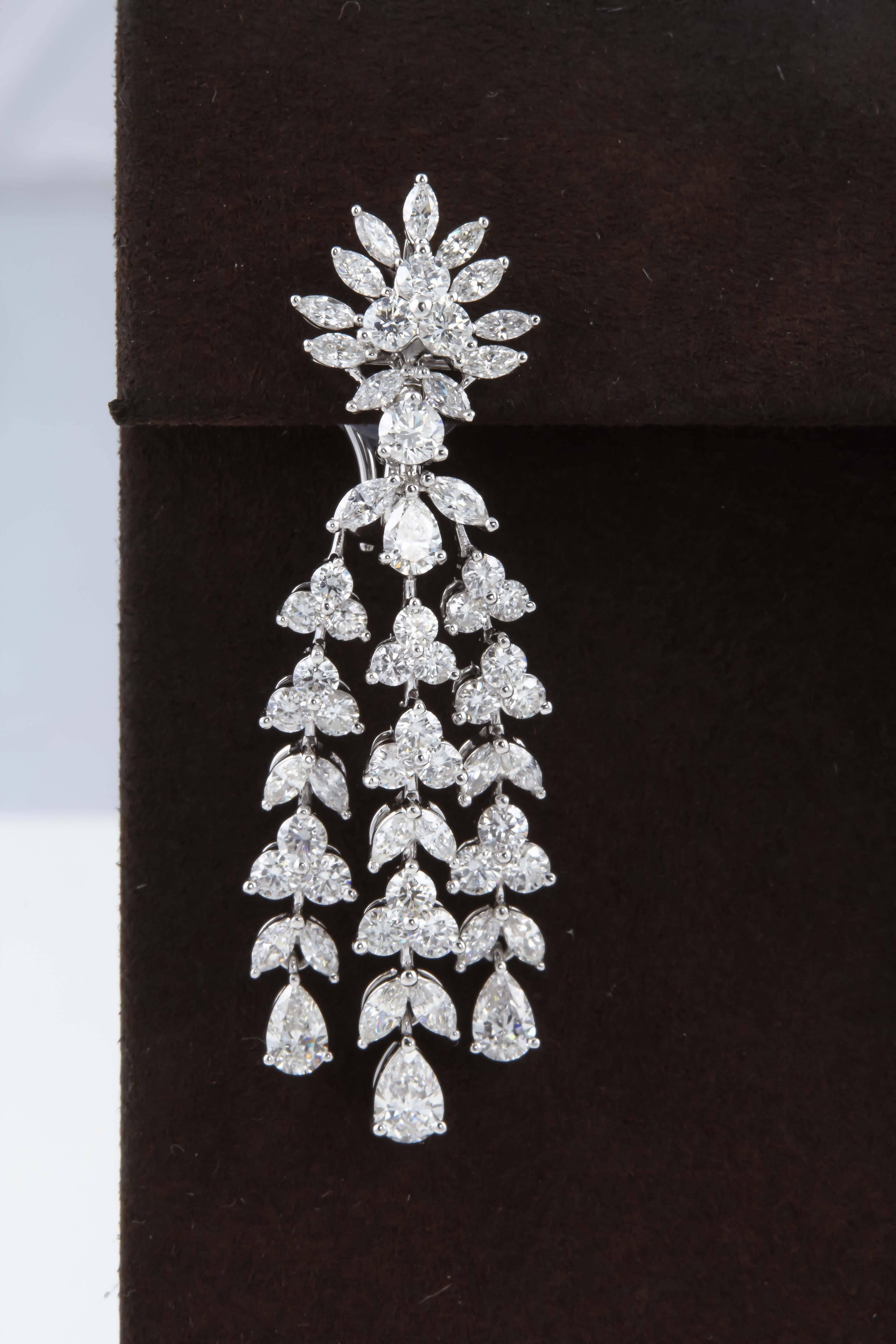 

A classic design with incredible movement and sparkle!

8.20 carats of G VS diamonds set in 18k white gold. 

Approximately 2 inches long

A fabulous earring with a grand look at a great price point. 


