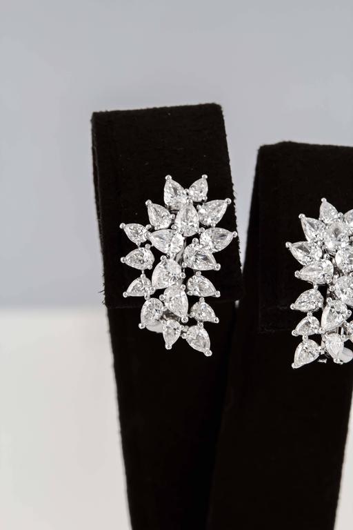 

An elegant earring in a wearable classic design.

3.42 carats of F/G color VS clarity pear shaped diamonds set in 18k white gold 

Approximately .84 inches in height and a little over half an inch at its widest points. 

A great gift and earring