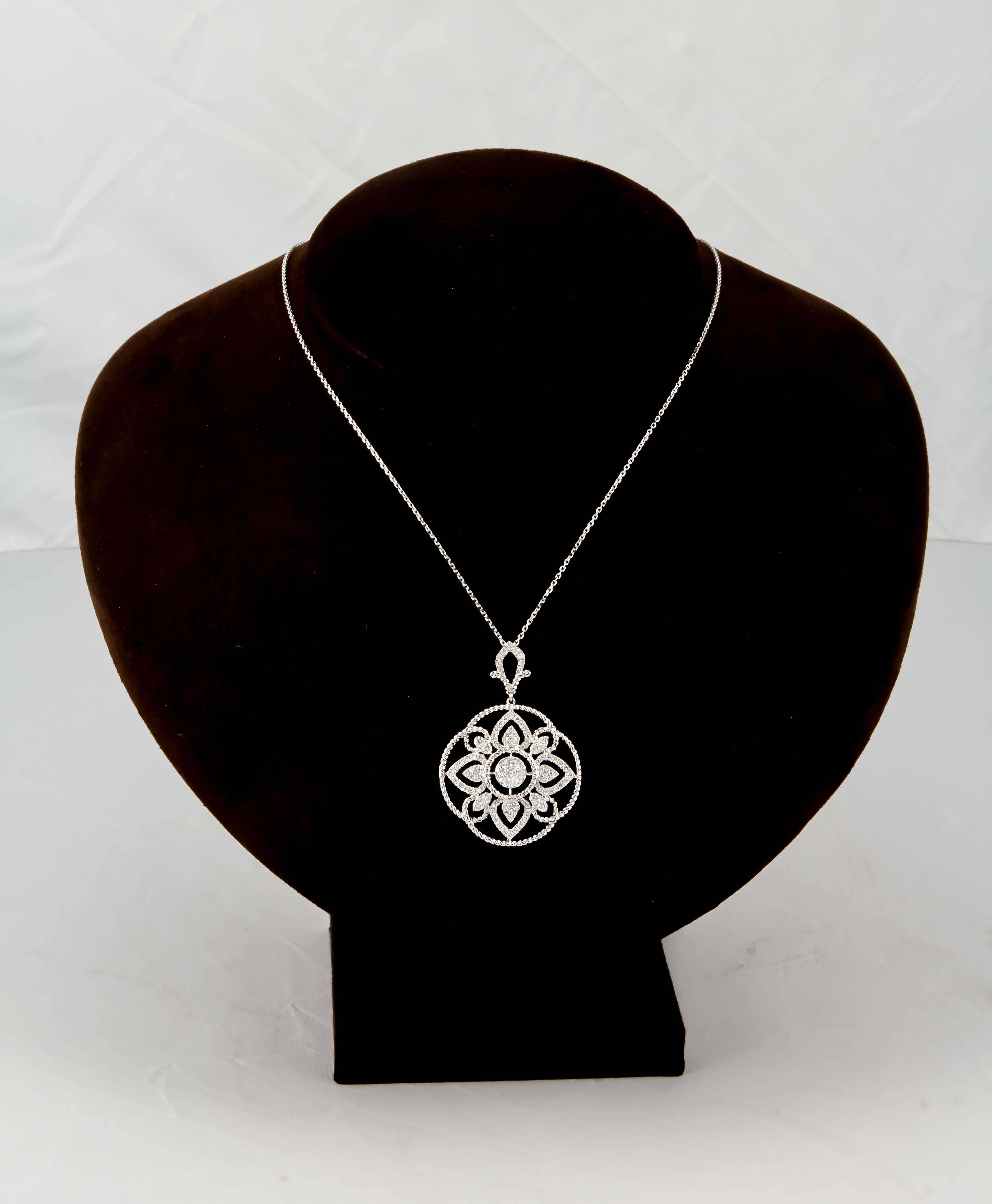 

An amazing gift!!

1.45 carats of F color VS clarity diamonds set in 18k white gold. 

An intricate design full of sparkle, the pendant also features braided gold detail. 

The pendant comes with a 16 inch white gold chain.

The circular portion