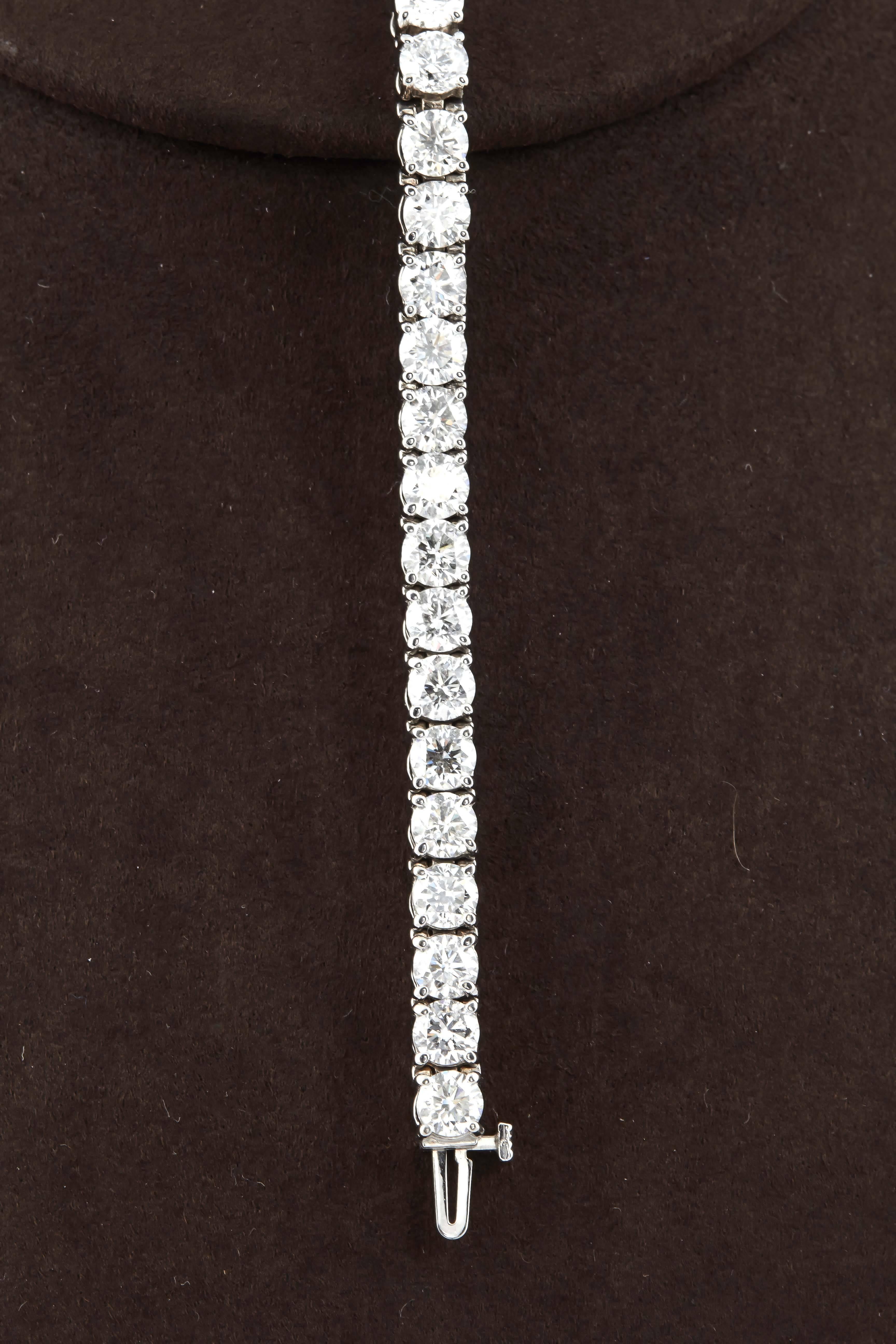 

A classic and important tennis bracelet.

18.70 carats of F/G color VS clarity round brilliant cut diamonds set in 14k white cold.

The diamonds average approximately .55 cts each. 

7 inch length
