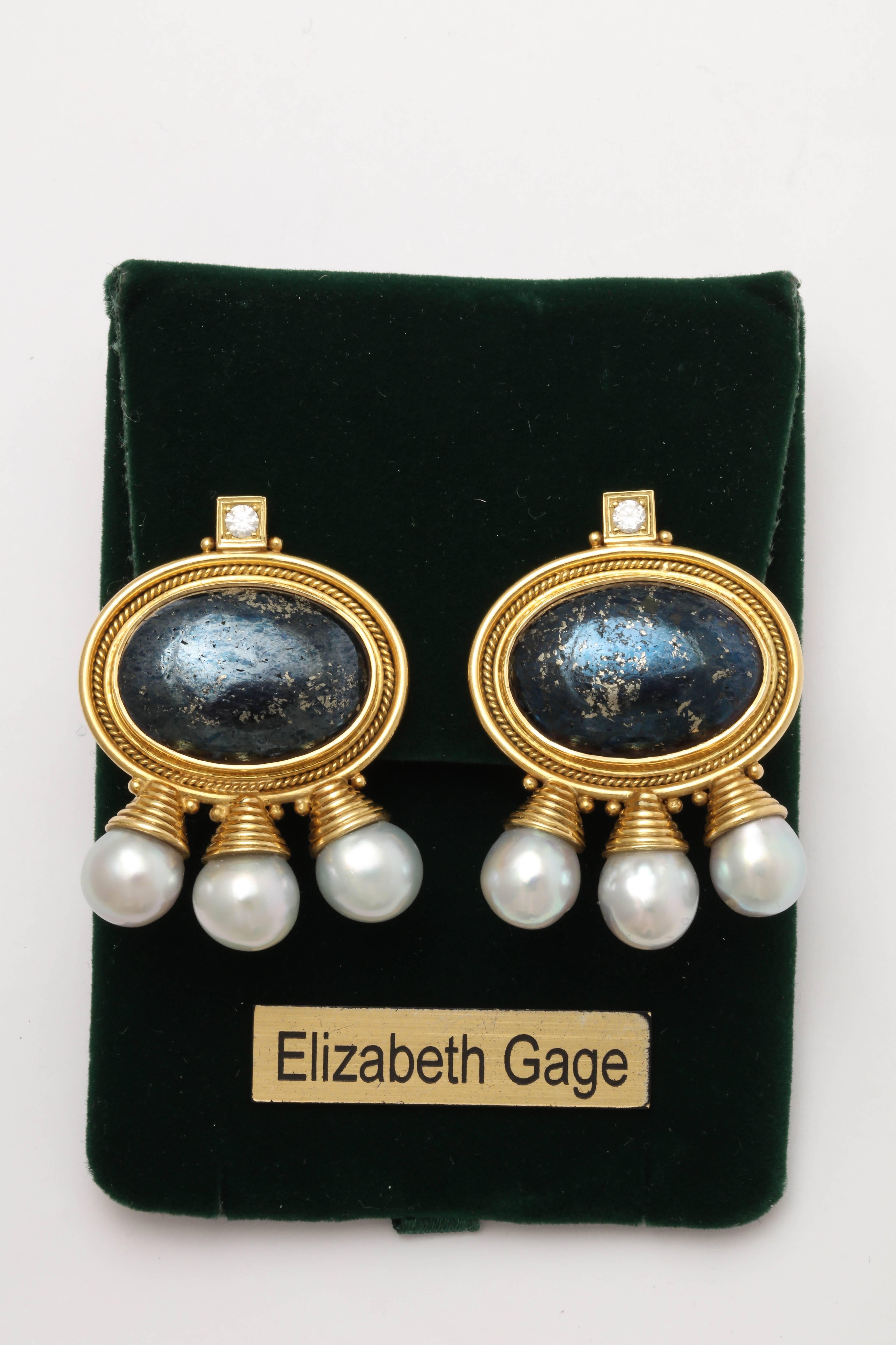 One  Ladies Gorgeous And Unique Pair Of African queen Large High Quality Earclips Designed With Two Large Oval Grey Goldstones Measuring Approximately 25MM Each And Further embellished With Six Large Cultured Grey Pearls Measuring Approximately 11Mm
