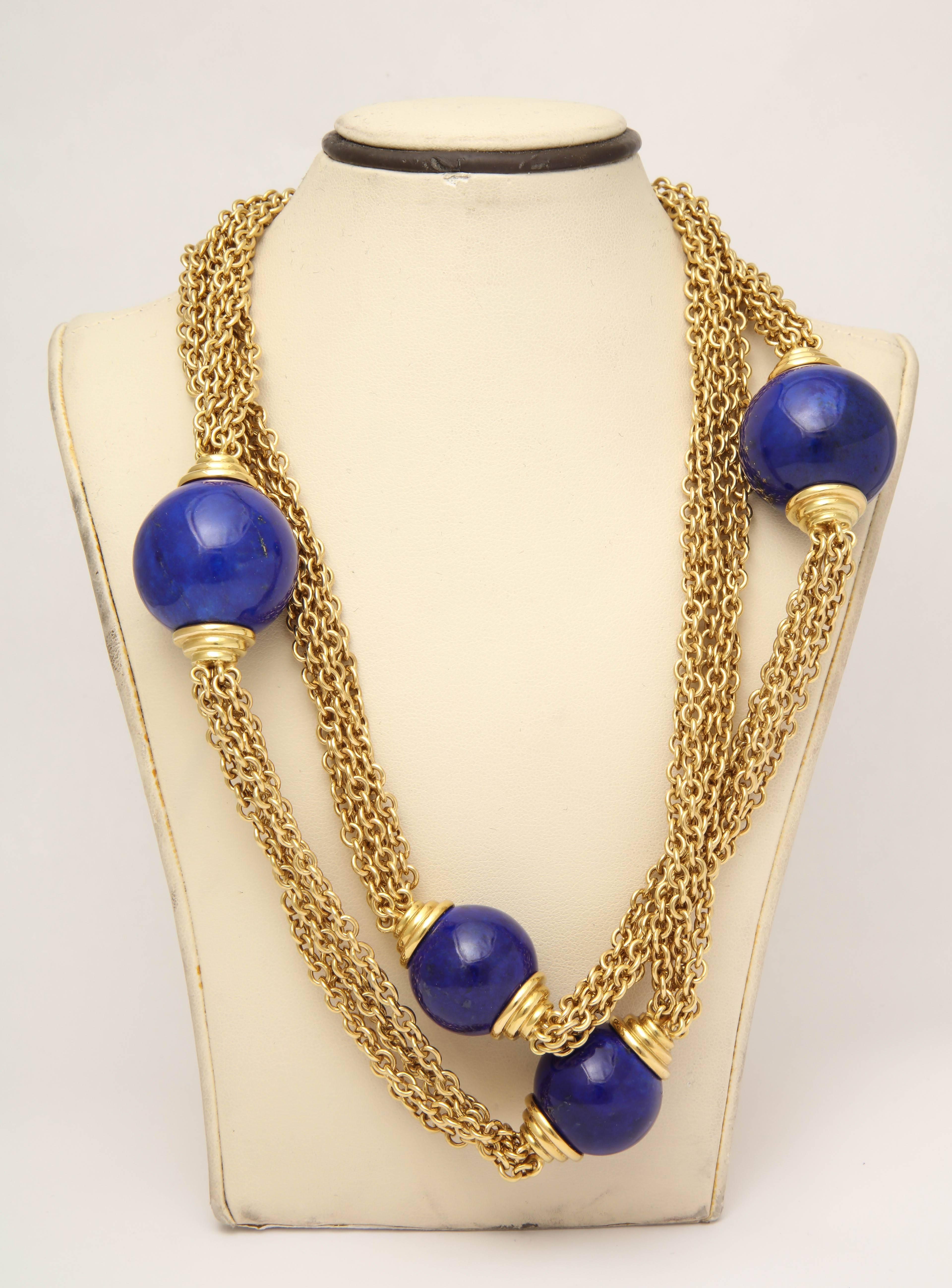 One Ladies Large And Long Five Strand Open Link Chain Necklace Consisting Of Five Flexible And Moveable Chains Which Are Embellished With Four Large High Quality Lapis Lazuli Balls Measuring 25mm Each On Bottom And 17 And 1/2 Mm Each On Top.