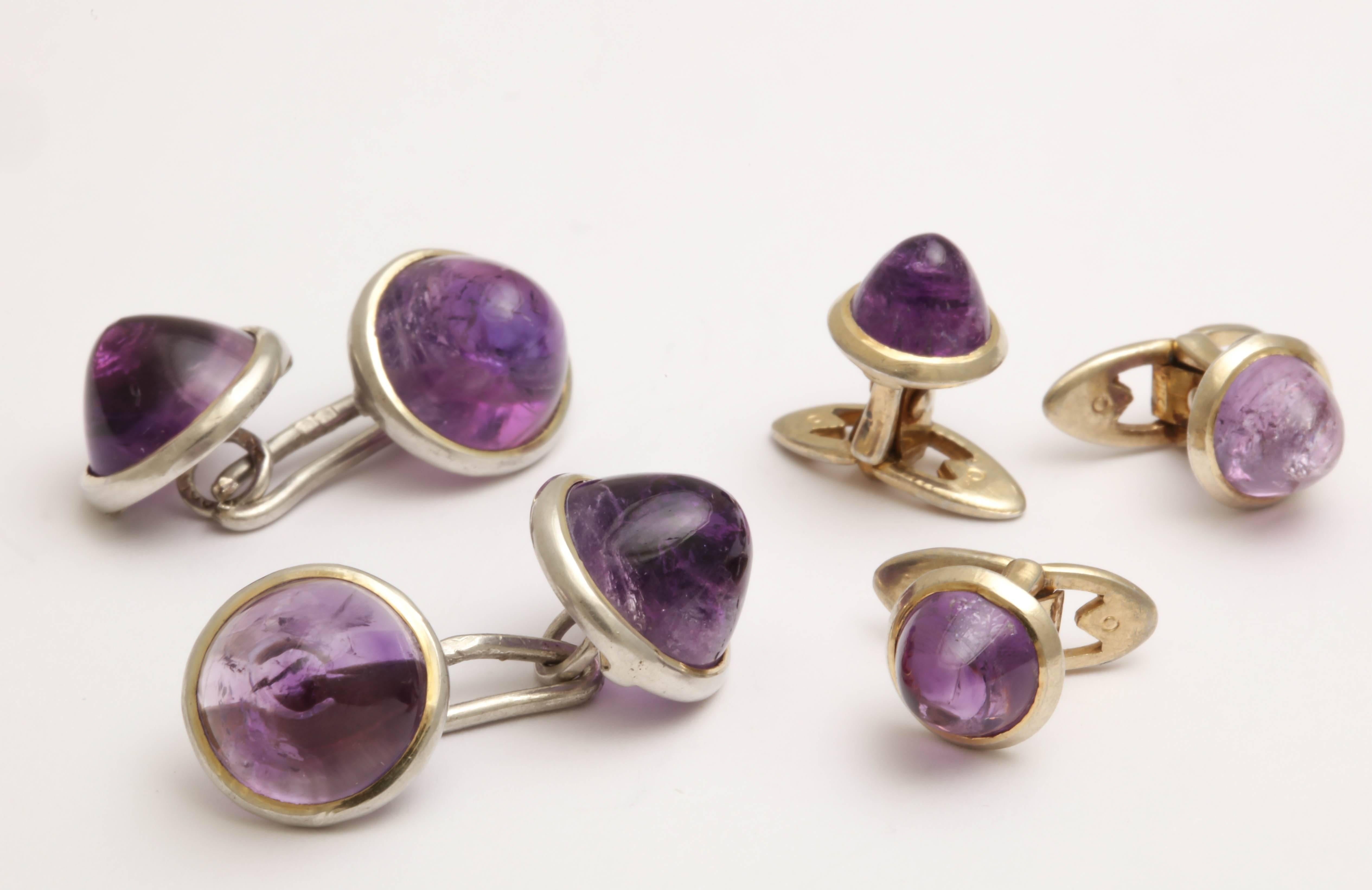 With pair of cufflinks and 3 studs,
With amethyst cabochons and silver border – 0.35 ozs. gross
Impressed S830/ GS.