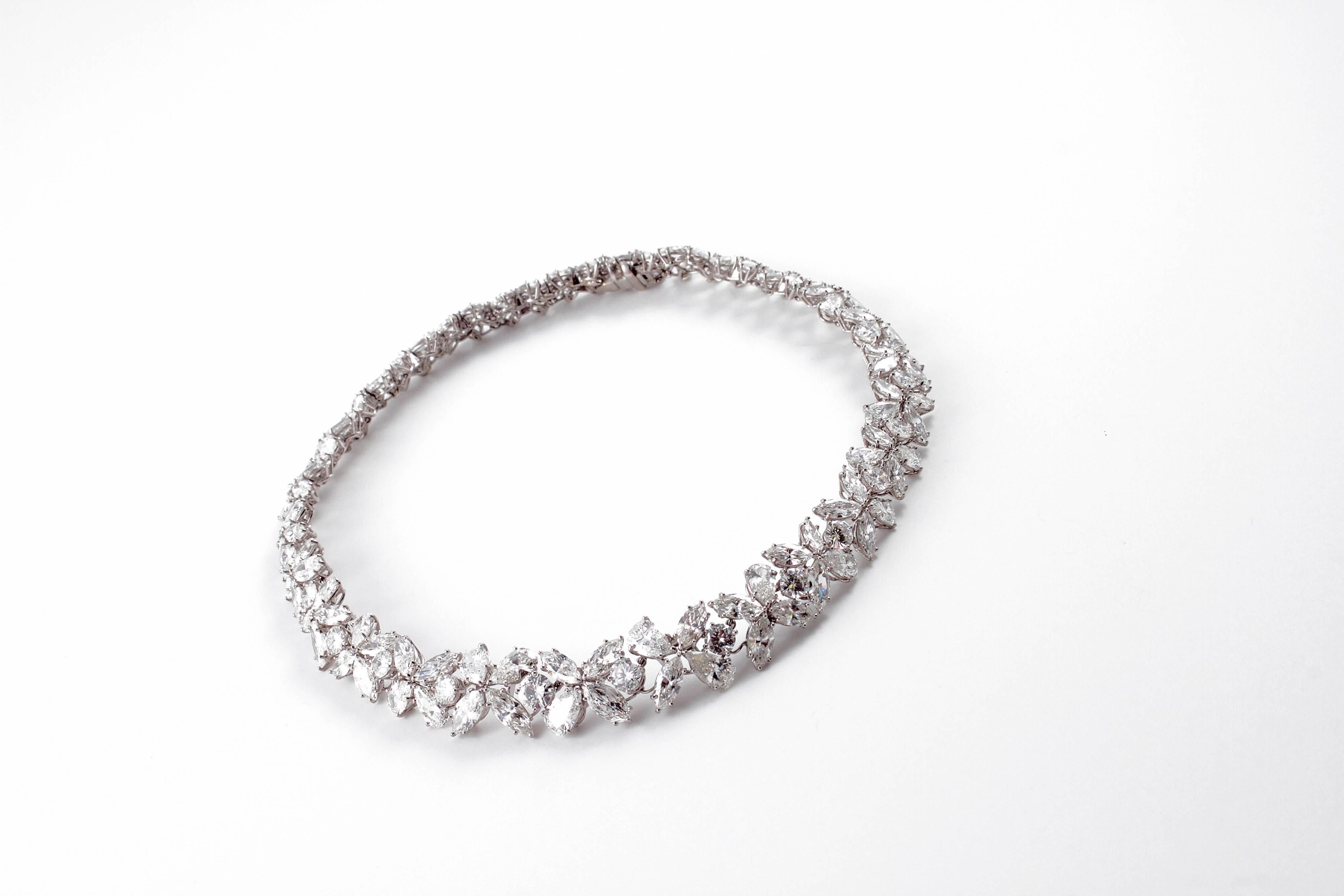 Composed of round, pear and marquise-shaped diamonds, in platinum, this incredible necklace is truly a work of art!  It measures approximately 15 inches in length.