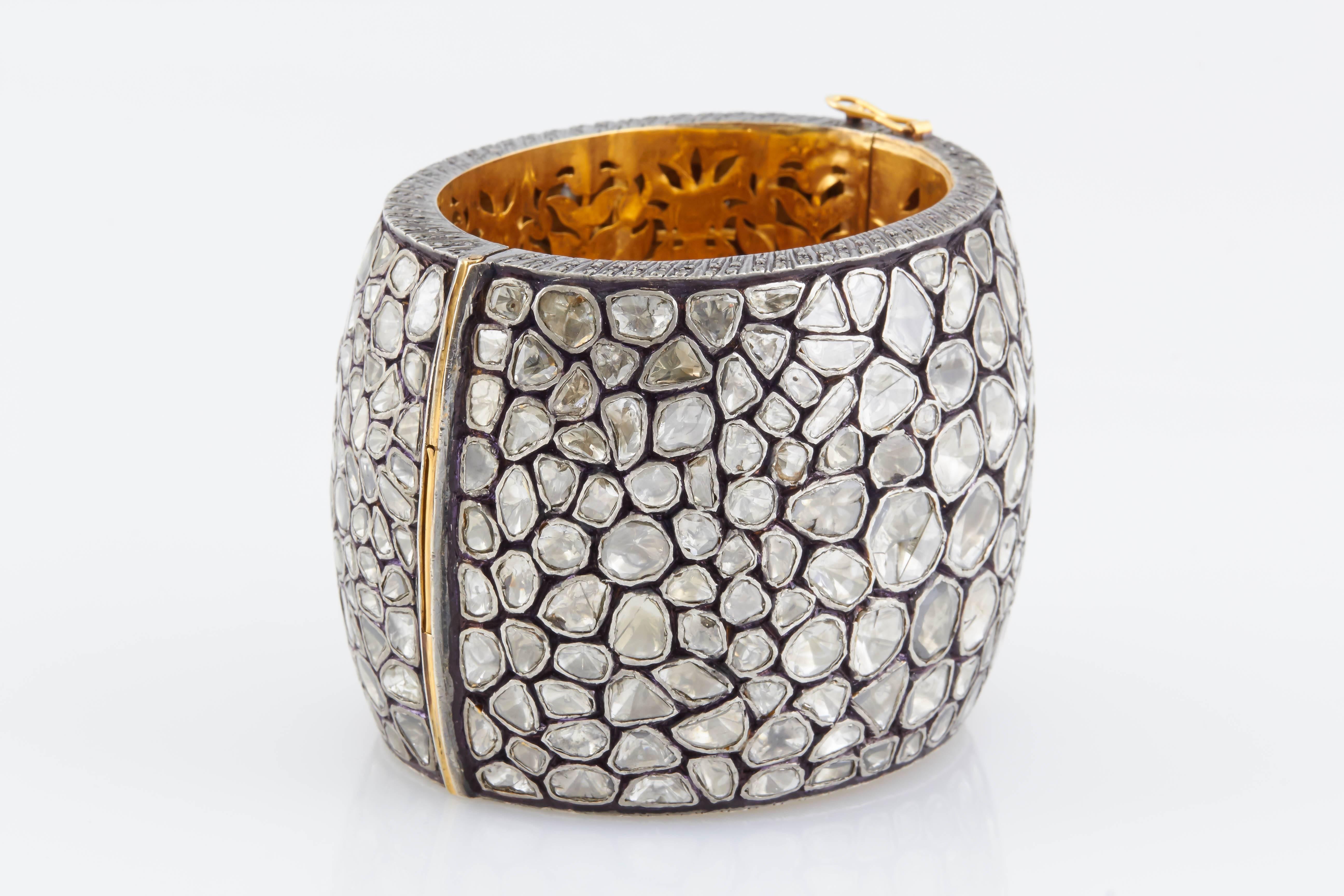 Contemporary Wide Cuff bracelet, finely crafted in silver and gold with varying sizes of rose cut diamonds.  