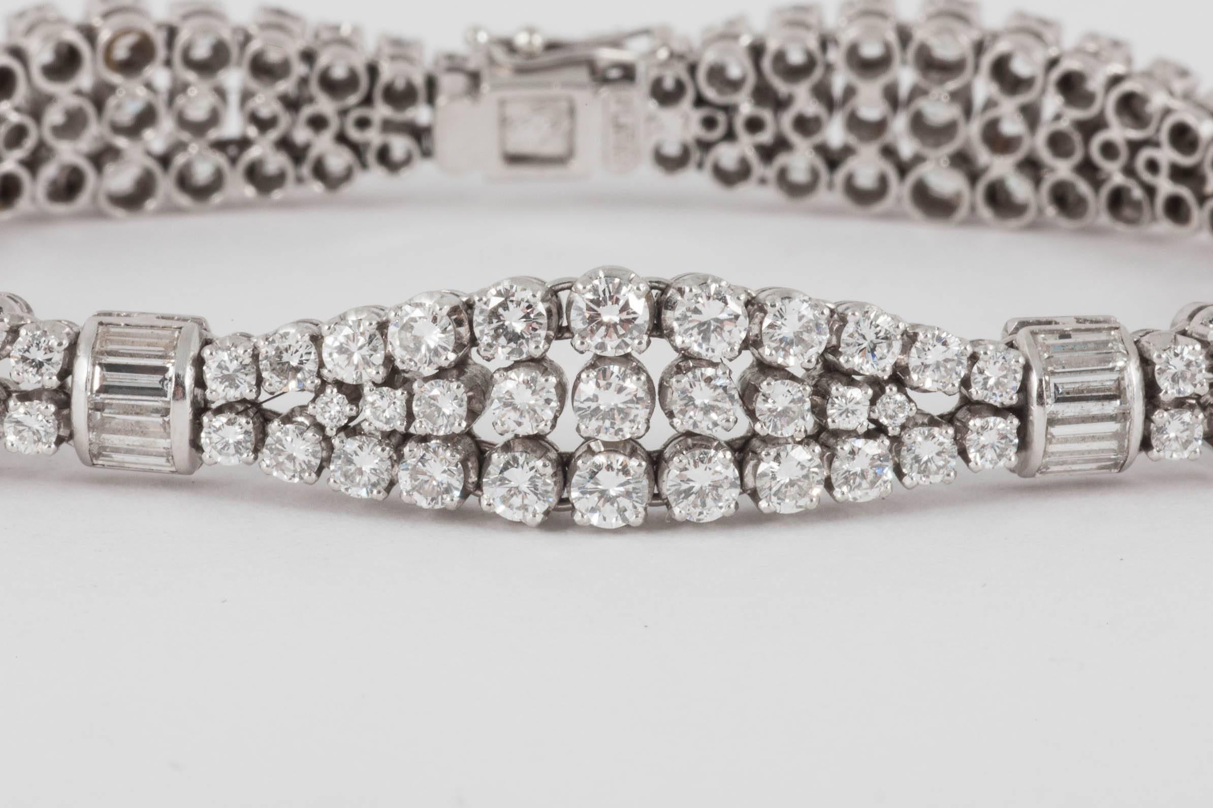 A fine,platinum mounted diamond bracelet set with brilliant cut diamonds,tied together with baguette cut diamonds,maker Gabuglio,c,1950,set with approximately 15 carats