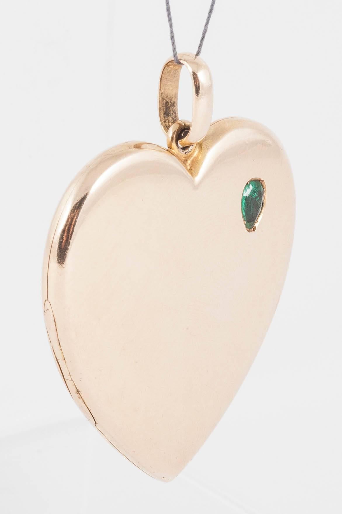 Late Victorian double locket in 15ct Gold inset with Emerald. 15ct stamped on top of loop