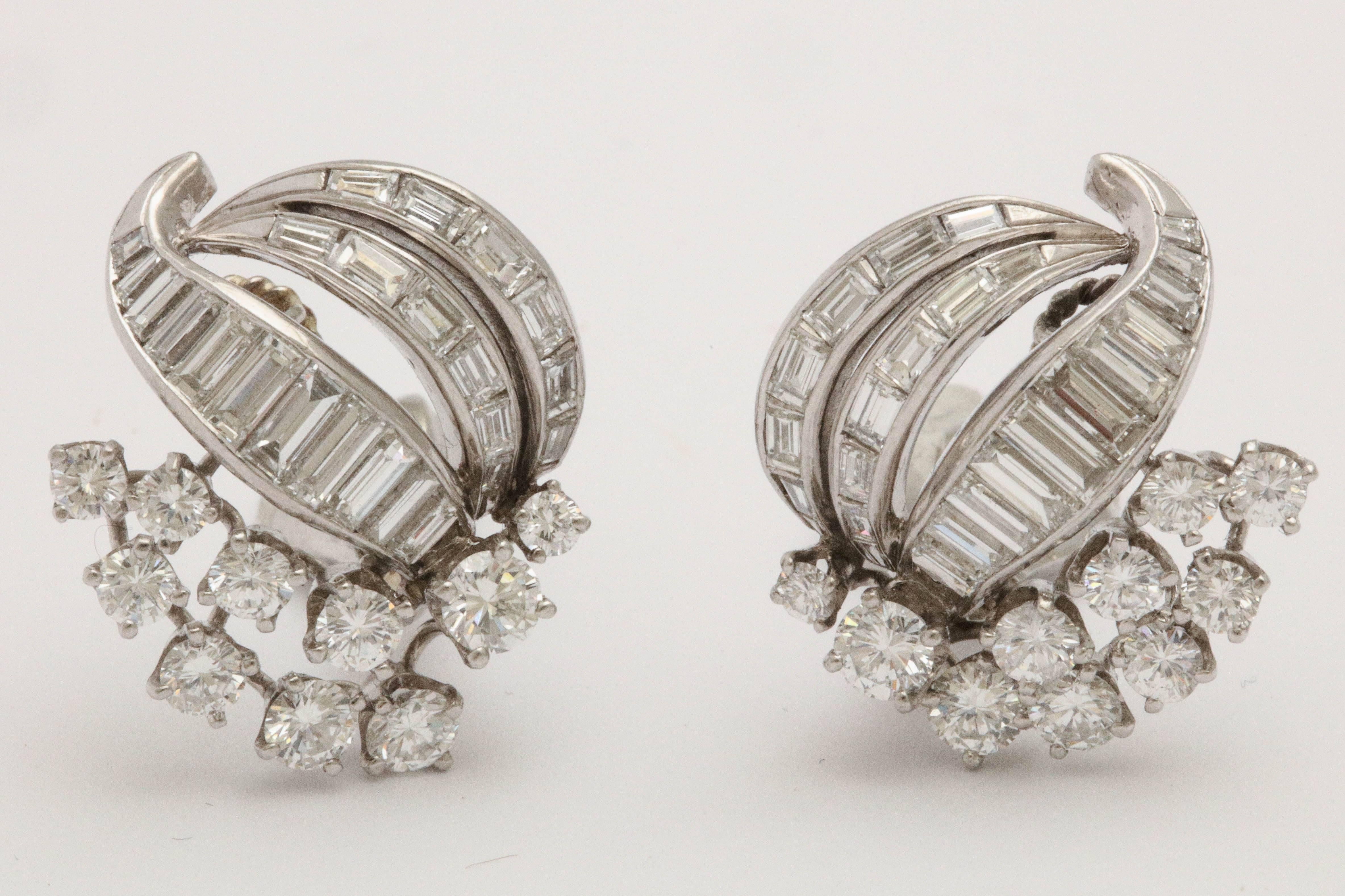 Platinum & super fine quality Diamond Earrings. Reminiscent of period  VCA and Winston style.   Ultra refined look that goes from early afternoon through cocktail & even the theater.  Very wearable.  An addition to an elegant wardrobe.
   A
