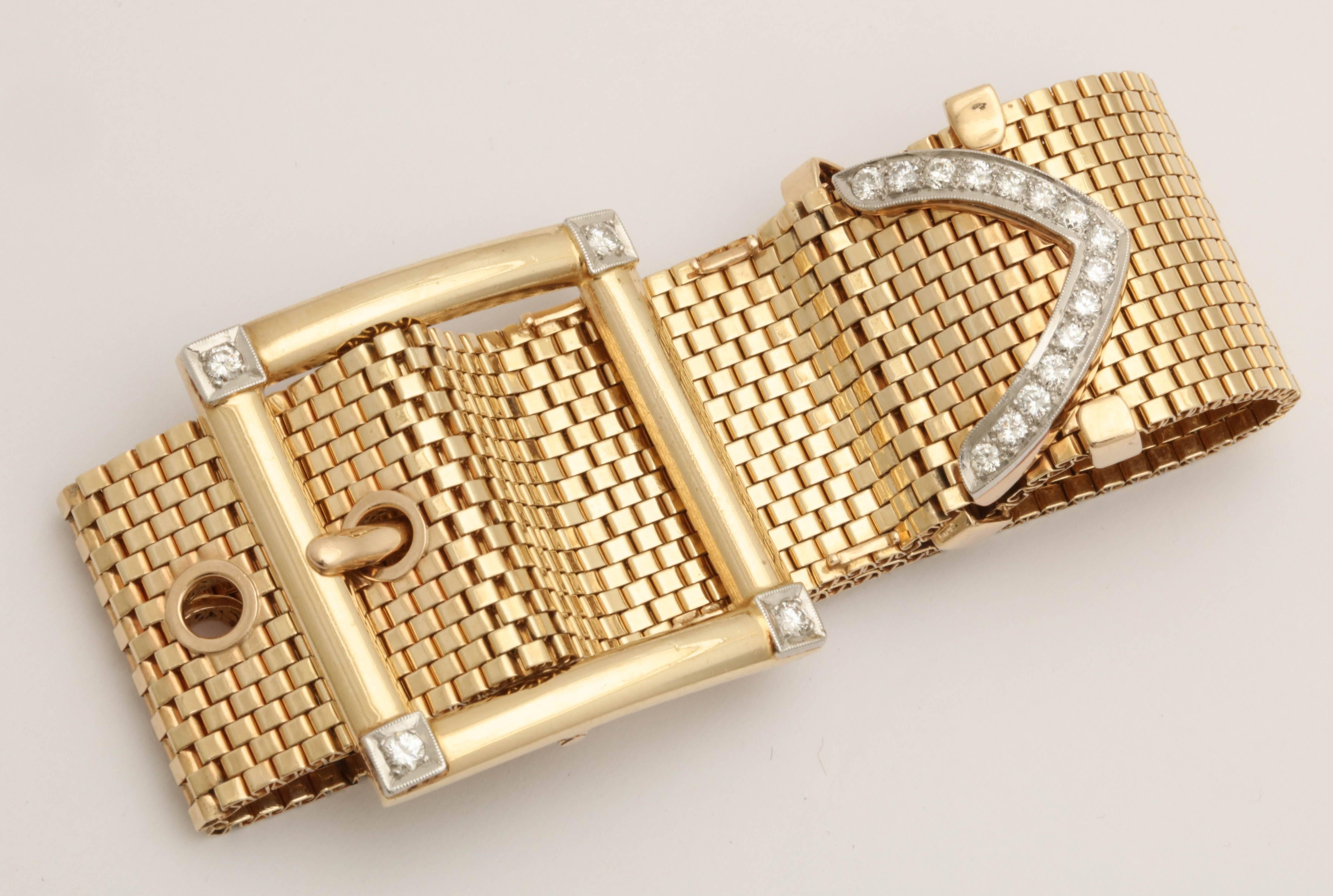 One Ladies 14kt Gold Brick Mesh Flexible Bracelet In Shape Of a Belt Buckle. With a High Polish Gold Buckle Embellished with 4 Full Cut Diamonds And Further Designed With 15 full cut diamonds on tip of the bracelet. Total Diamond weight