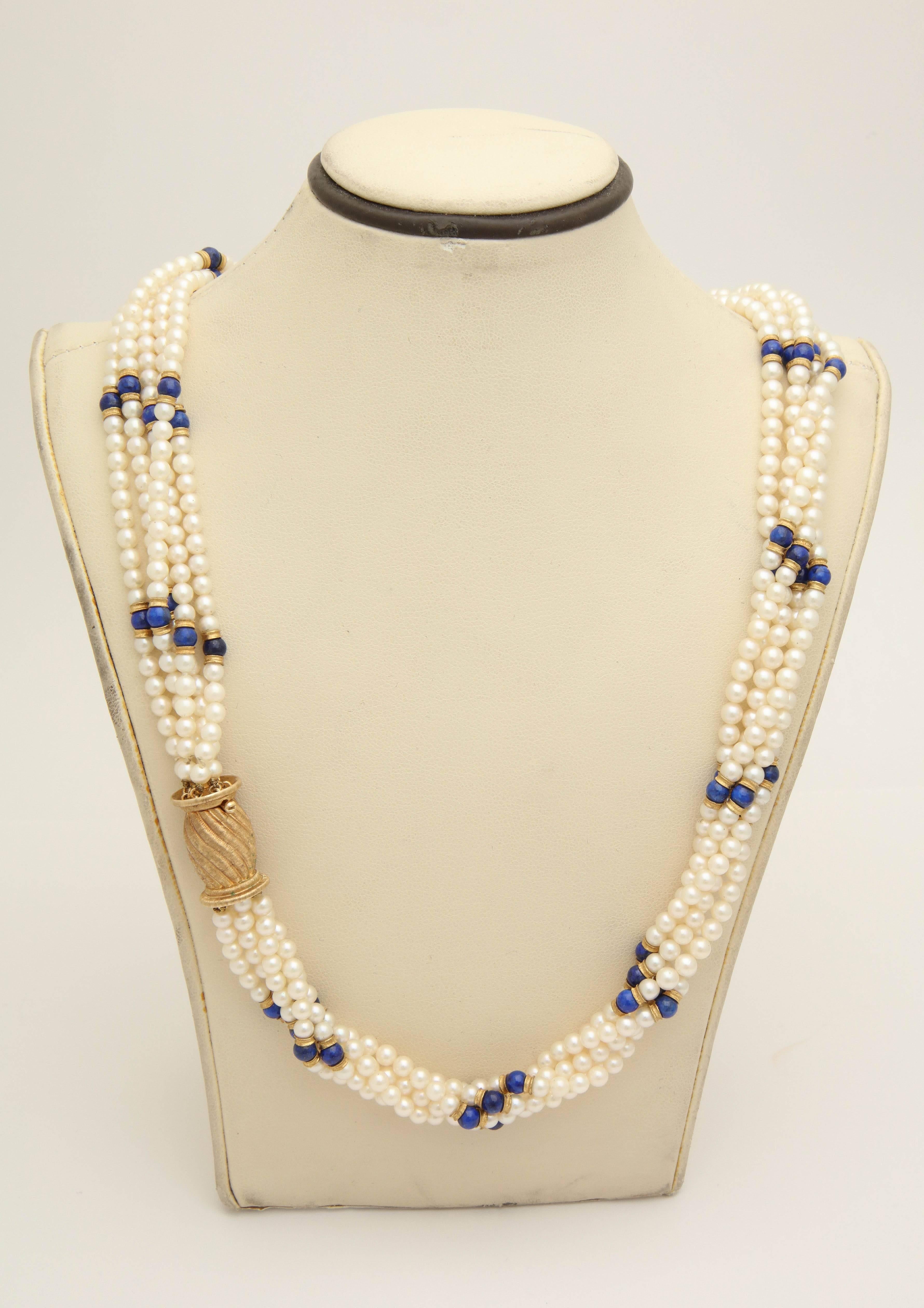 One Ladies 18kt Gold Multi-Strand Necklace Composed Of Numerous 2Mm High Luster And Beautiful Quality Cultured Pearls And Further Designed With Sixty Beautiful Color Lapis Lazuli Beads. Each Lapis Set In between Two 18kt Gold Rondell Pieces. This