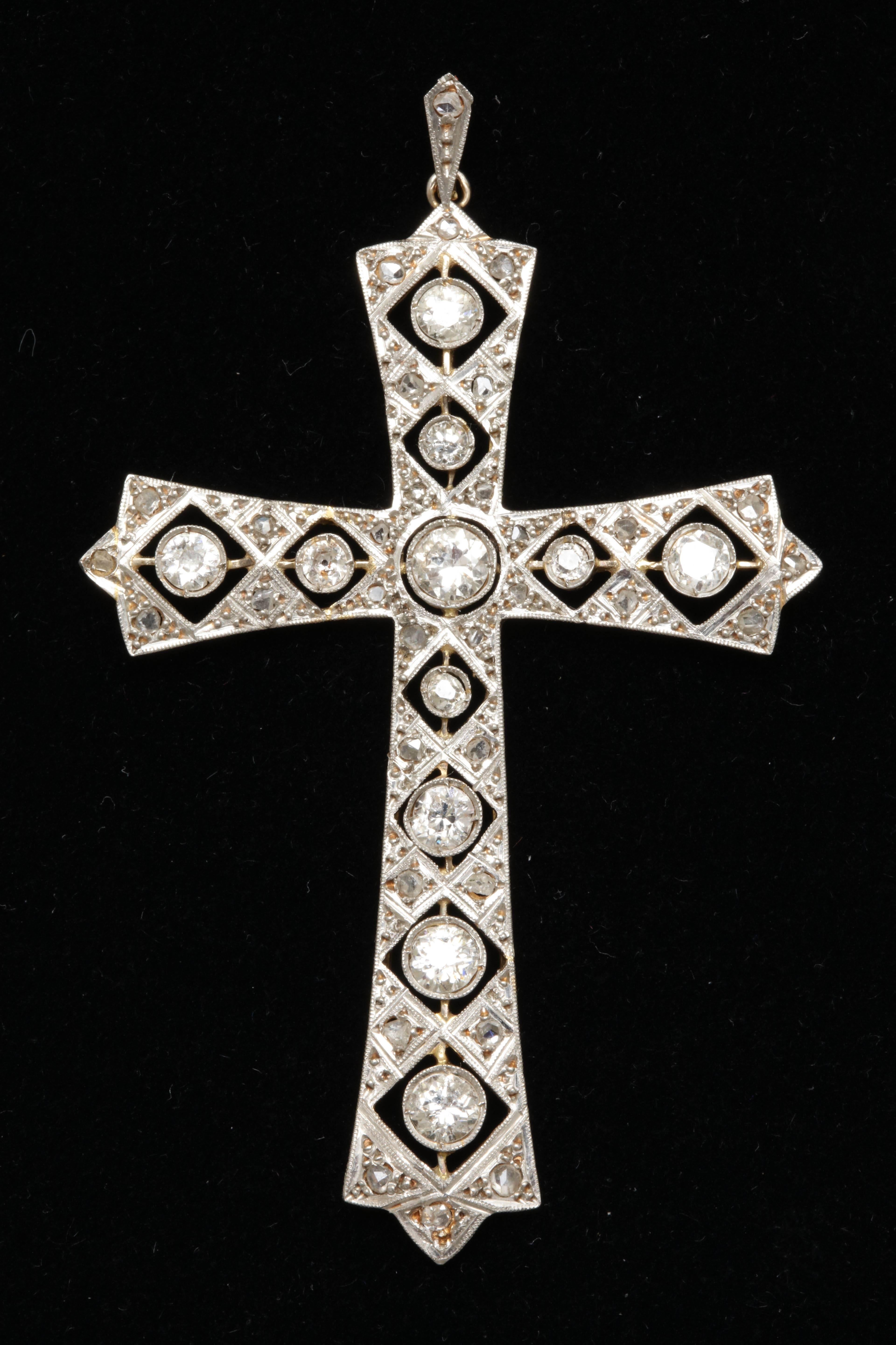 One Ladies Antique Cut Diamond Platinum And 18kt Yellow Gold Cross Pendant Exhibiting Beautiful Handmade Cut Out workmanshipThru Out The Piece. Further Embellished With Rose Cut Diamonds. total diamond Weight Approximately 2 Carats Total Weight,
