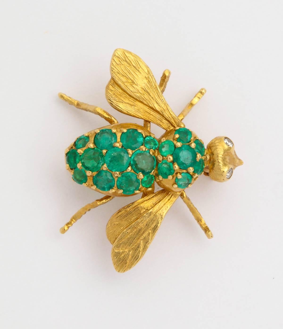 18k yellow gold and Emerald baby bee brooch 3/4 inch long  wing span 15/16 of an inch set with 18 emeralds 1.00 carat
