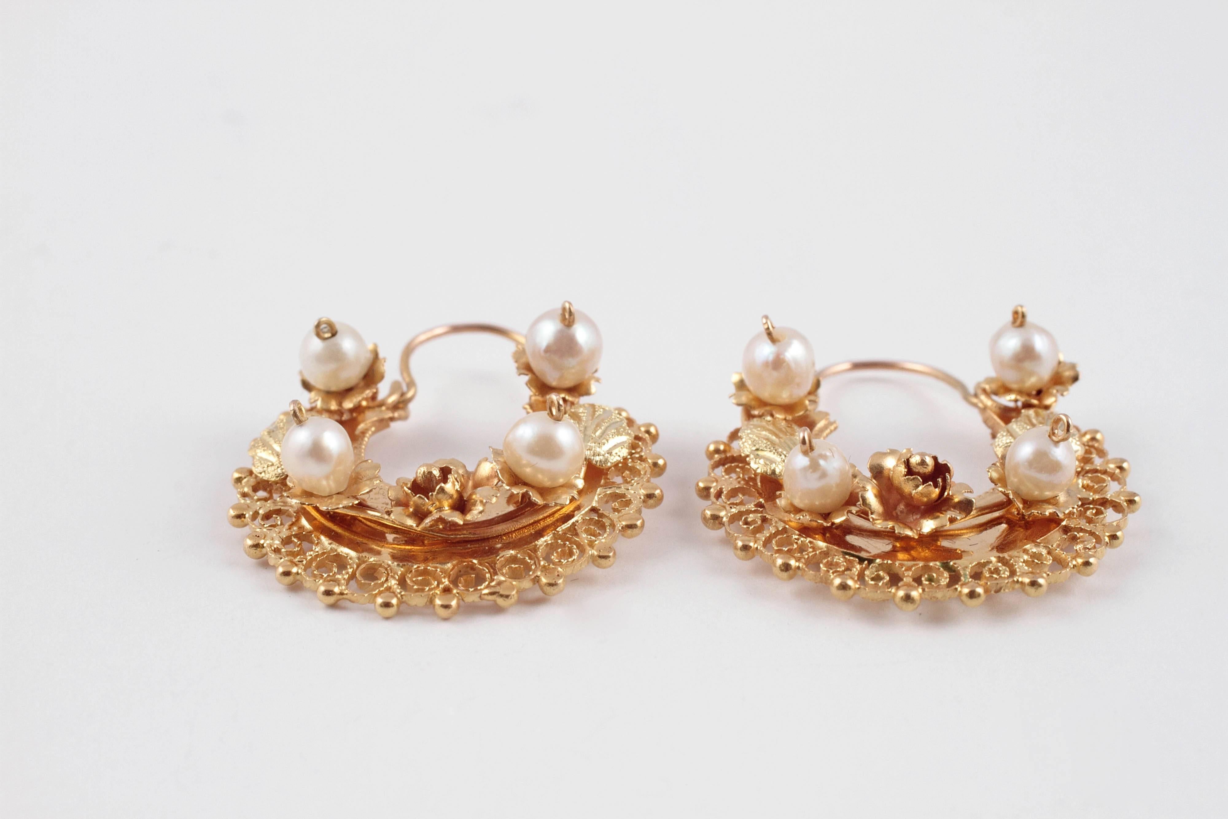 Pearl half hoop earrings in 14 karat yellow gold.  These are stunning on the ears!