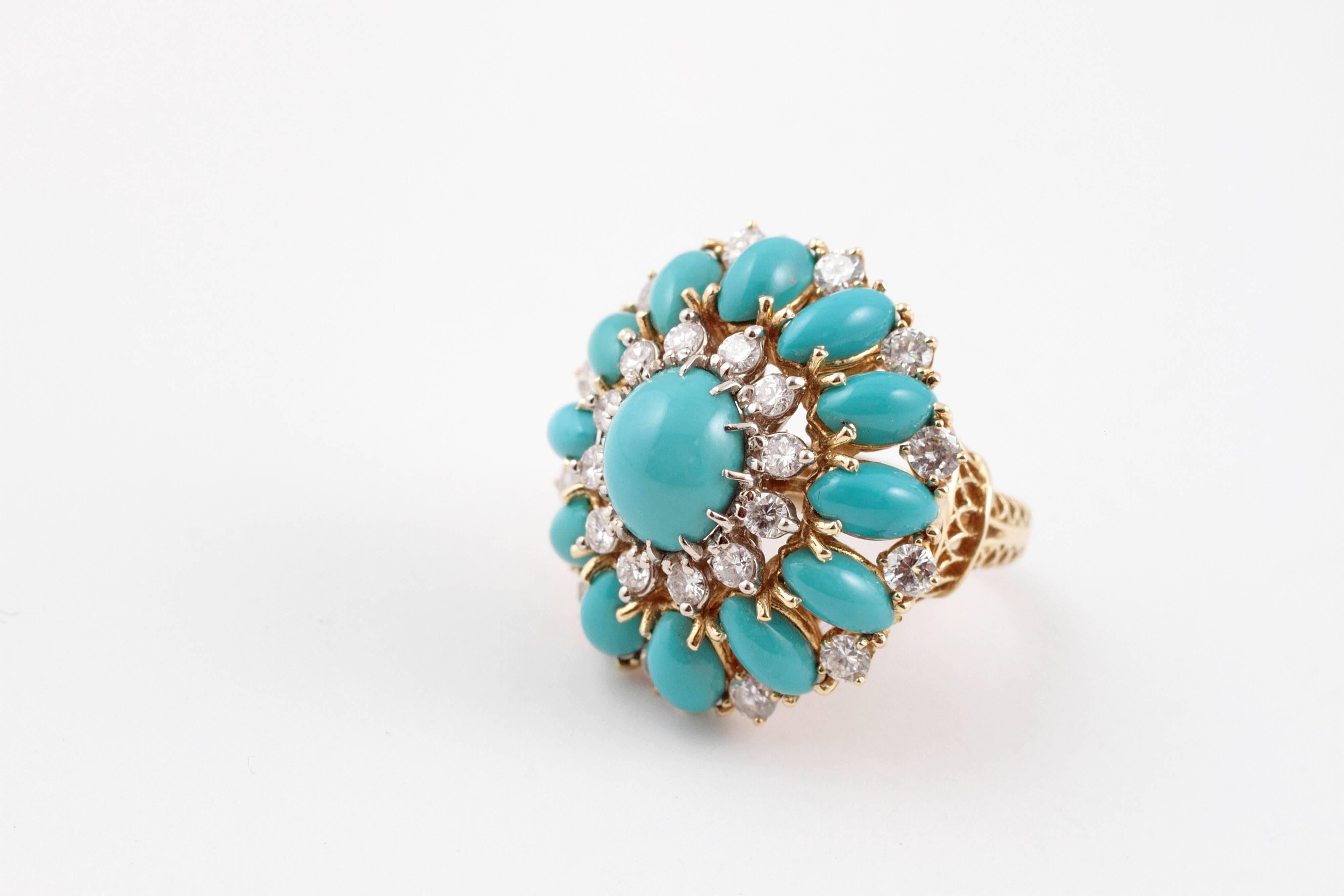 Turquoise lovers rejoice!  This exquisite natural turquoise and diamond ring in detailed 18 karat yellow gold mounting will be a fabulous addition to your jewelry collection.  Size 7 1/4. 