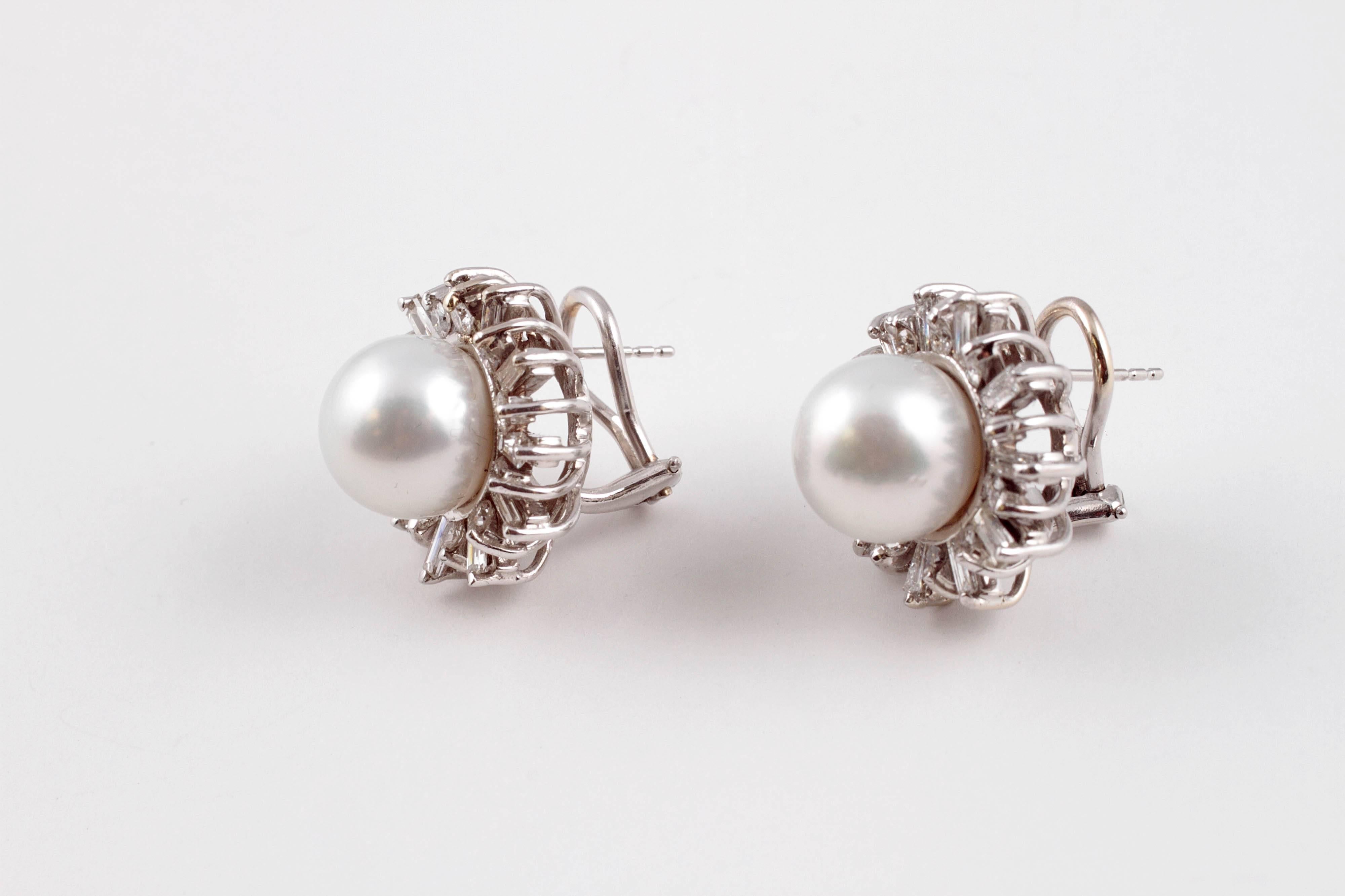 Lustrous 11.35 millimeter South Sea pearls with 3.05 carats of diamonds in 14 karat white gold earrings.