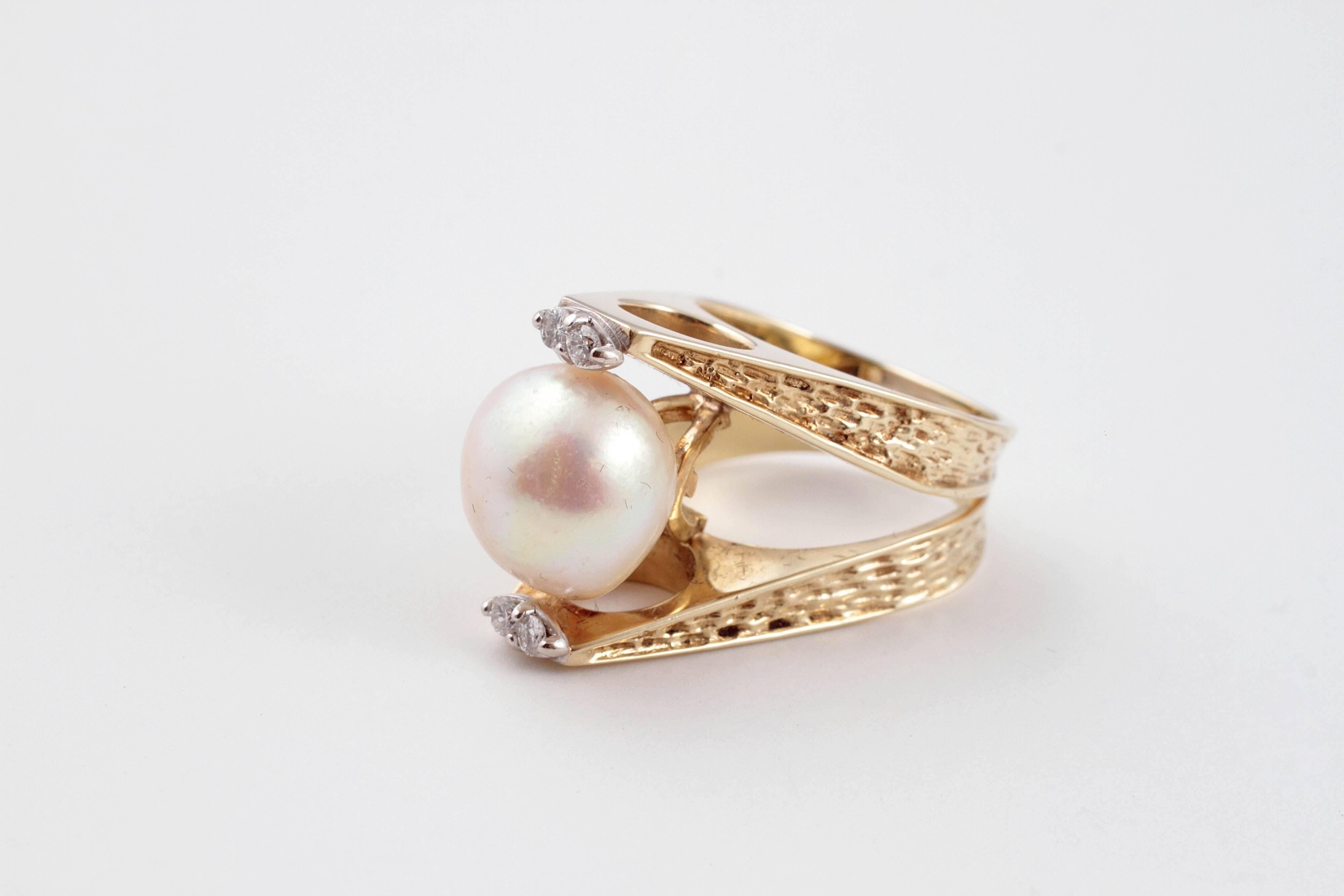 11.35 mm cultured pearl ring with diamond accents in textured yellow gold linear style mounting.  Size 6.
