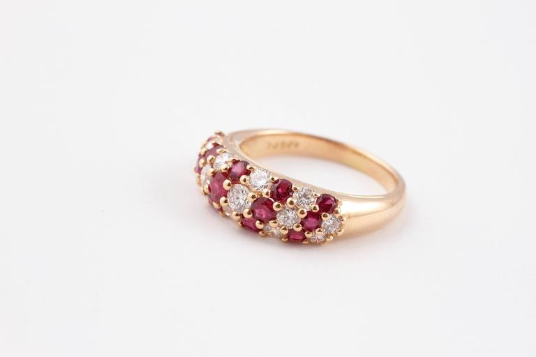 Gorgeous ruby and diamond ring by designer Oscar Heyman, in 18 karat yellow gold. Size 7 1/4.