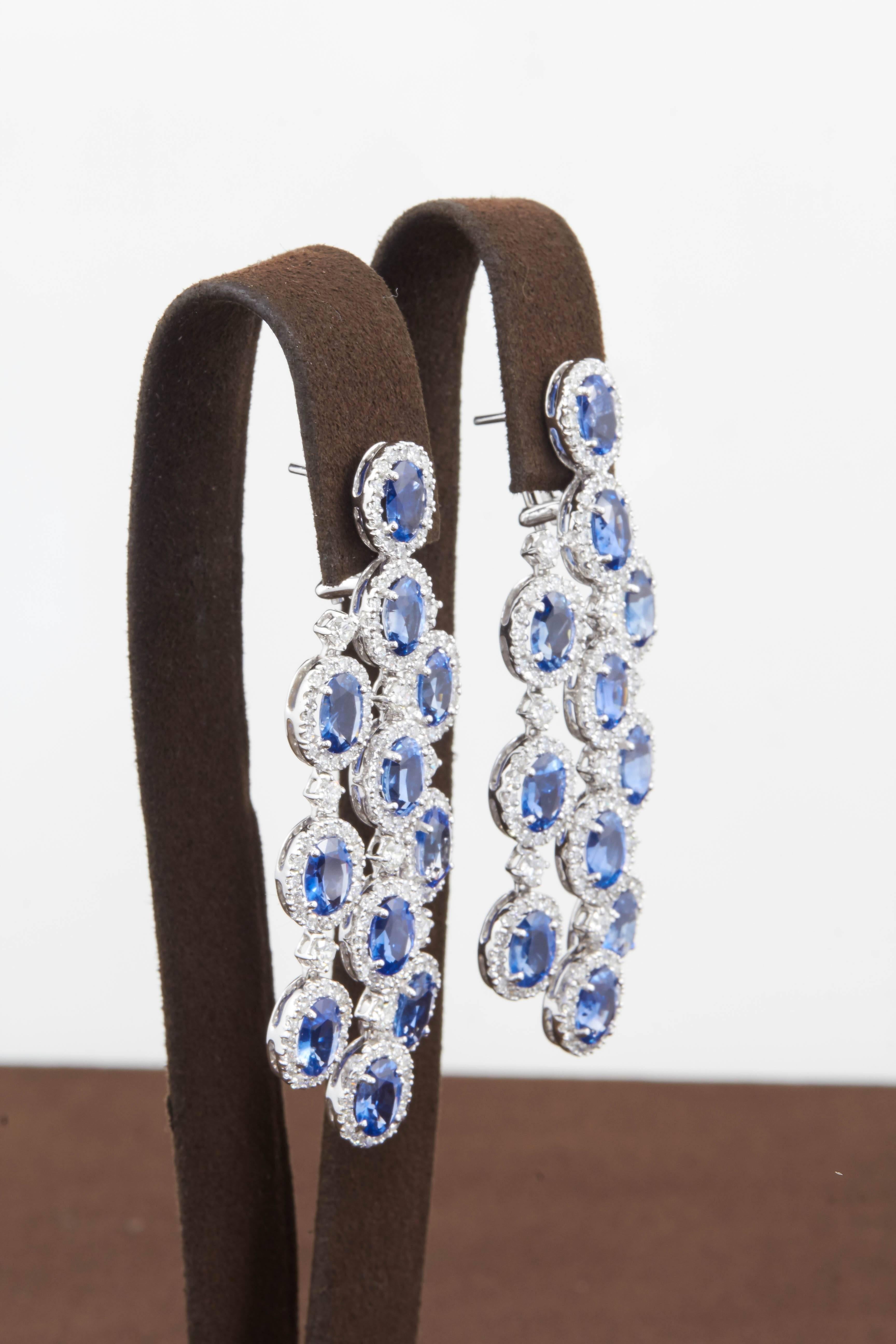 

A gorgeous pair of sapphire and diamond earrings.

24.05 carats of fine oval shaped blue Ceylon sapphires

6.68 carats of G color VS clarity diamonds

18k white gold

Approximately 2.5 inches long, .85 inches wide. 

A very wearable design, can be