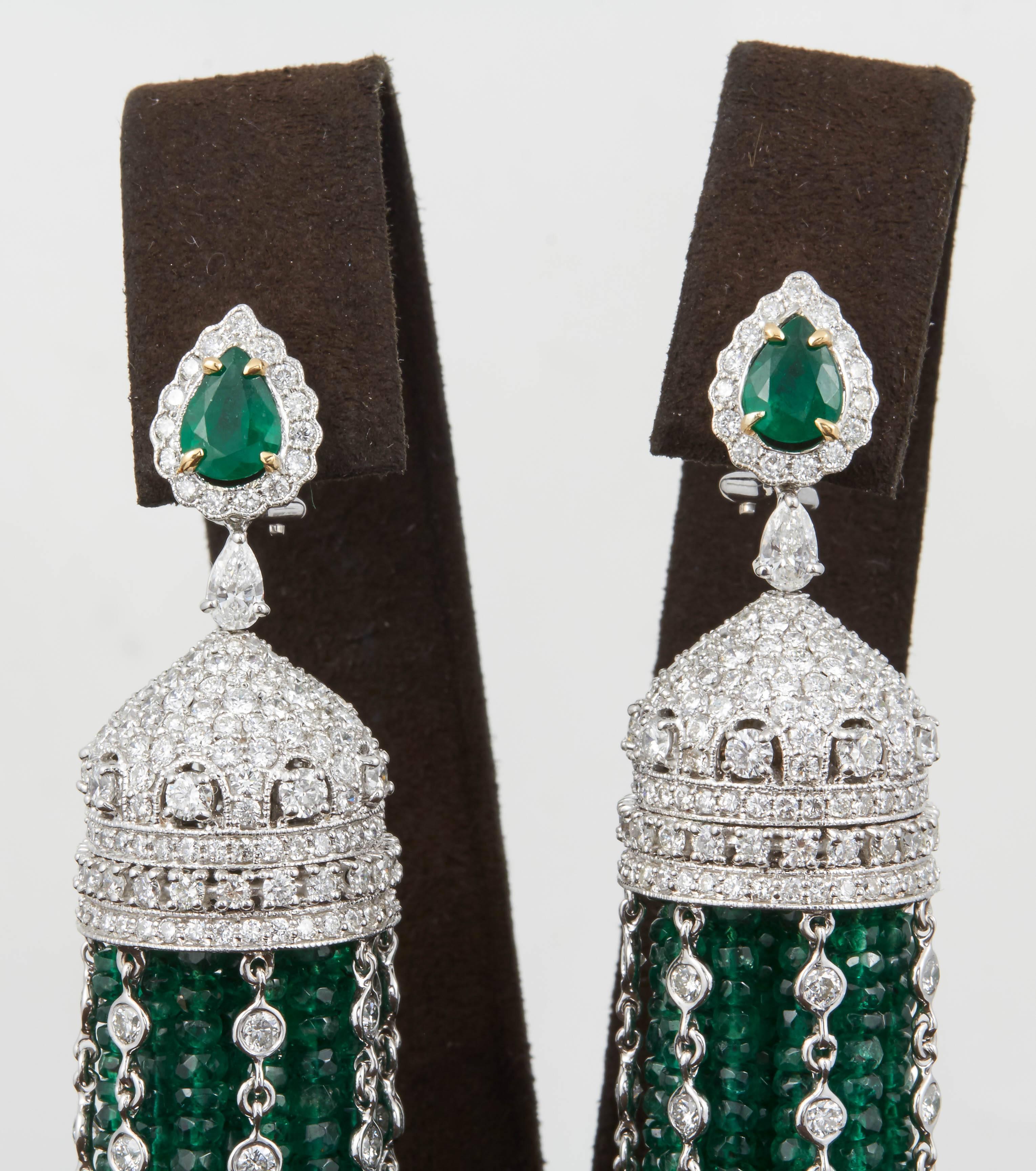 

A FABULOUS pair of earrings! Beautiful emerald green color and movement!

Over 300 carats of emeralds, 18.08 carats of diamonds.

18K white gold.

Approximately 4.75 inches in length from top to bottom.

This piece can be warn casually or to a