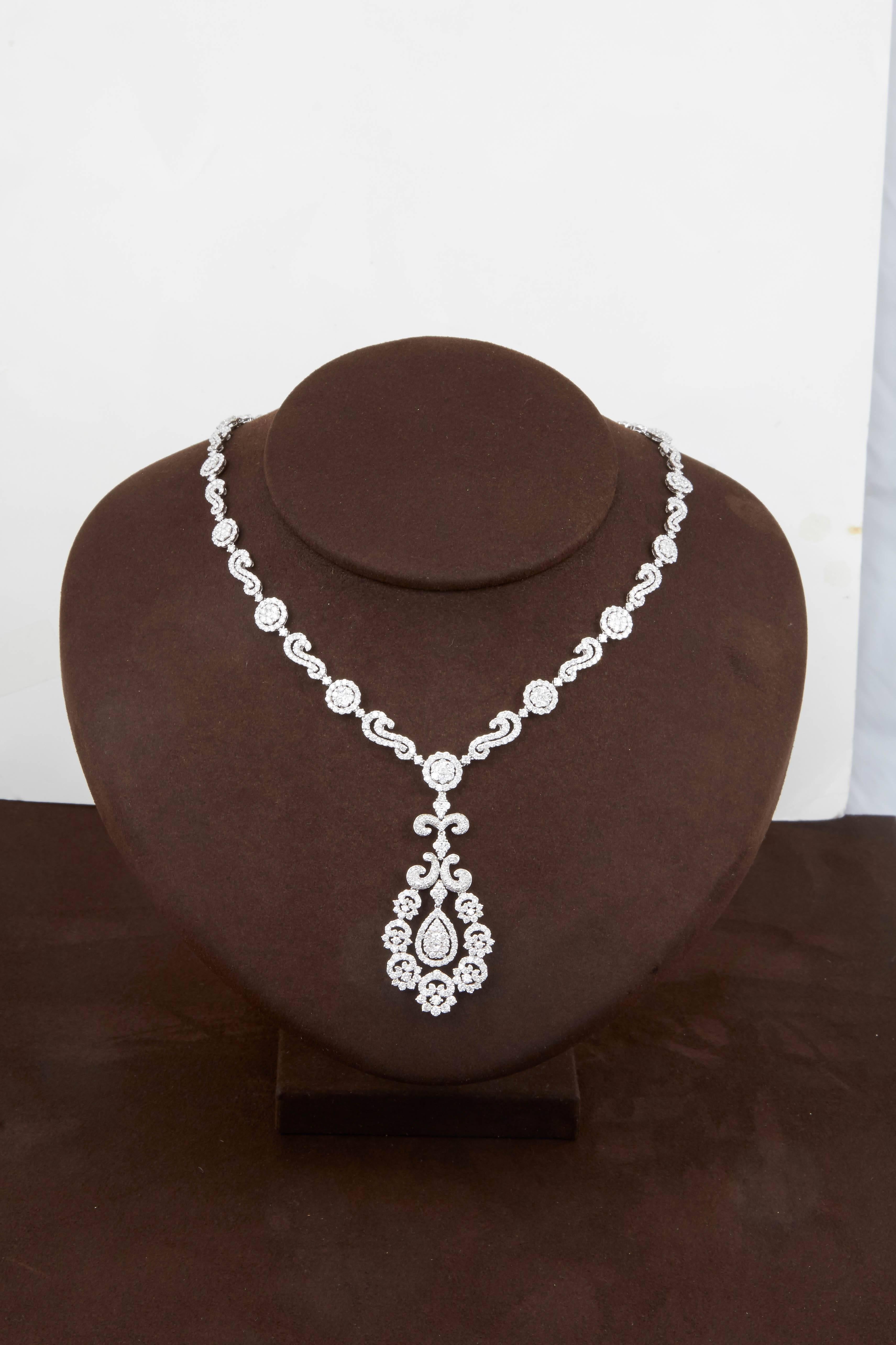 

Full of SPARKLE!

A gorgeous diamond necklace featuring 15.01 carats of F/G diamonds set in 18k white gold. 

Approximately 16.75 inch neck size but can be easily adjusted. 

The pendant drop measures approximately 2.16 inches.

