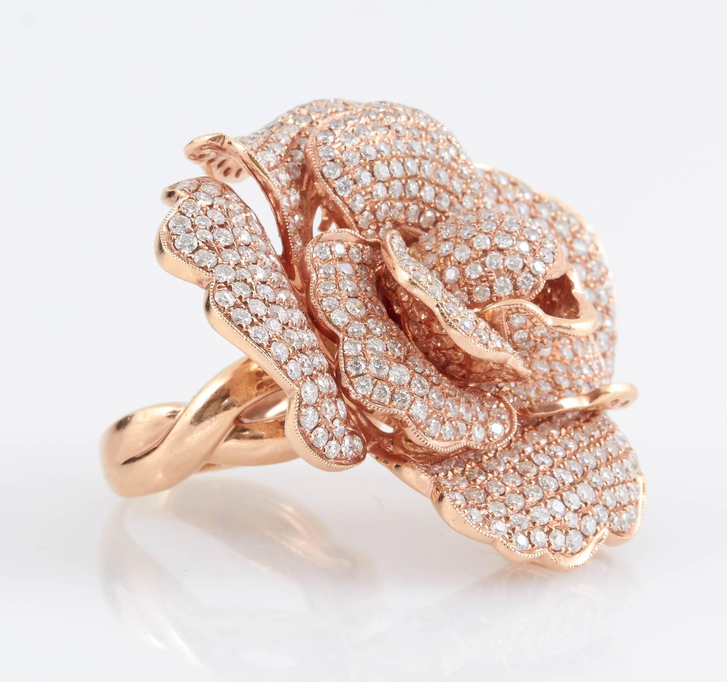 Stunning Pavé Rose diamond ring featuring round cut diamonds, weighing a total of 8.34 carats, finely crafted in 14K rose gold. This ring has a removable shank to wear the rose as a pendant. 
