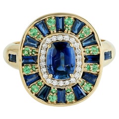 Bague en or jaune 18k avec saphir bleu de Ceylan et tsavorite et diamants