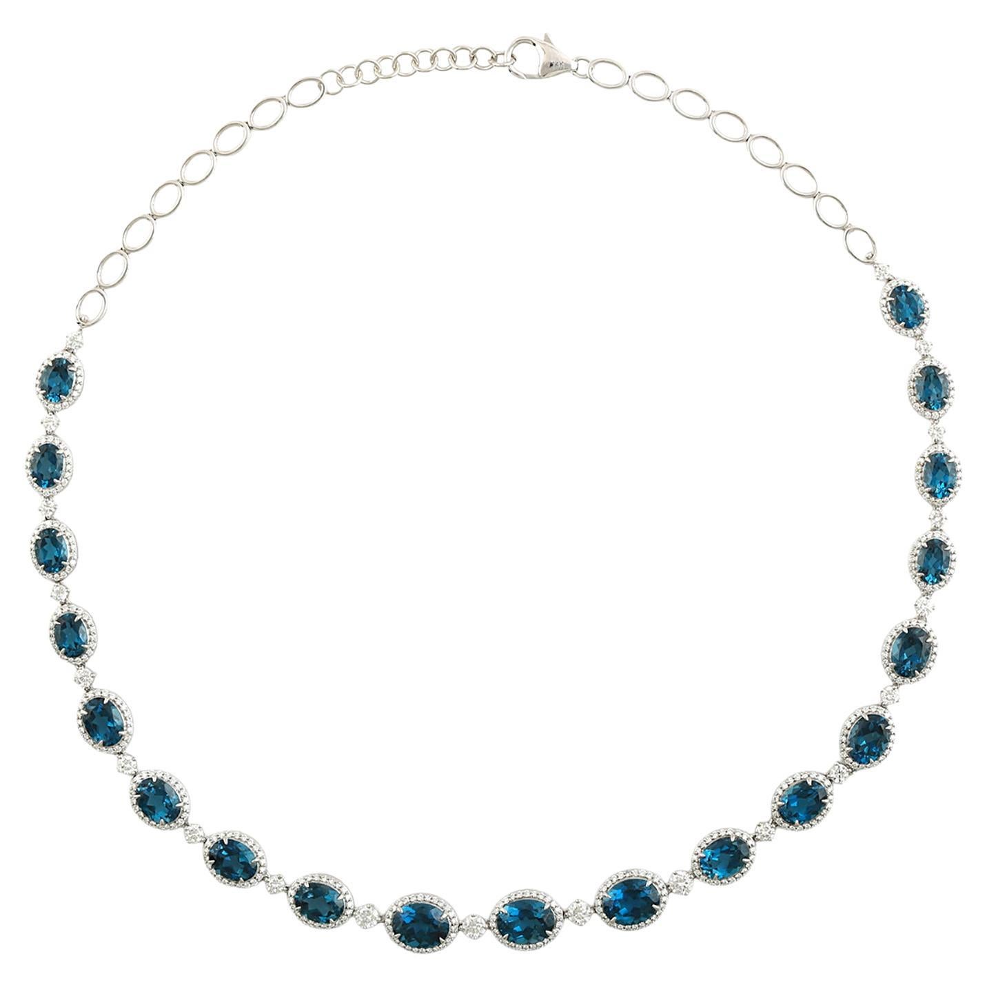 Collana di topazio blu ovale con diamanti in oro bianco 14 carati in vendita