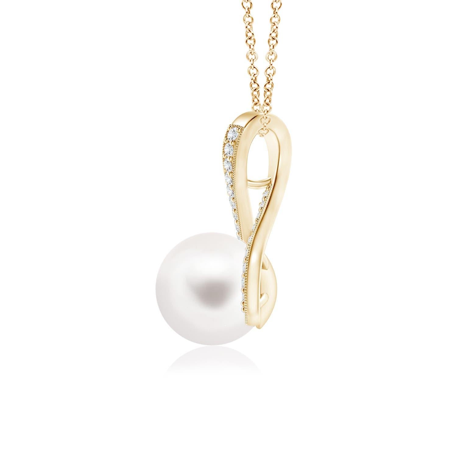 Un gracieux tourbillon de diamants fixe la perle de culture d'eau douce au centre de ce collier solitaire. Les diamants ronds en pavage embellissent la boucle et rehaussent la beauté de la perle. Une chaîne peut être passée à travers ce superbe