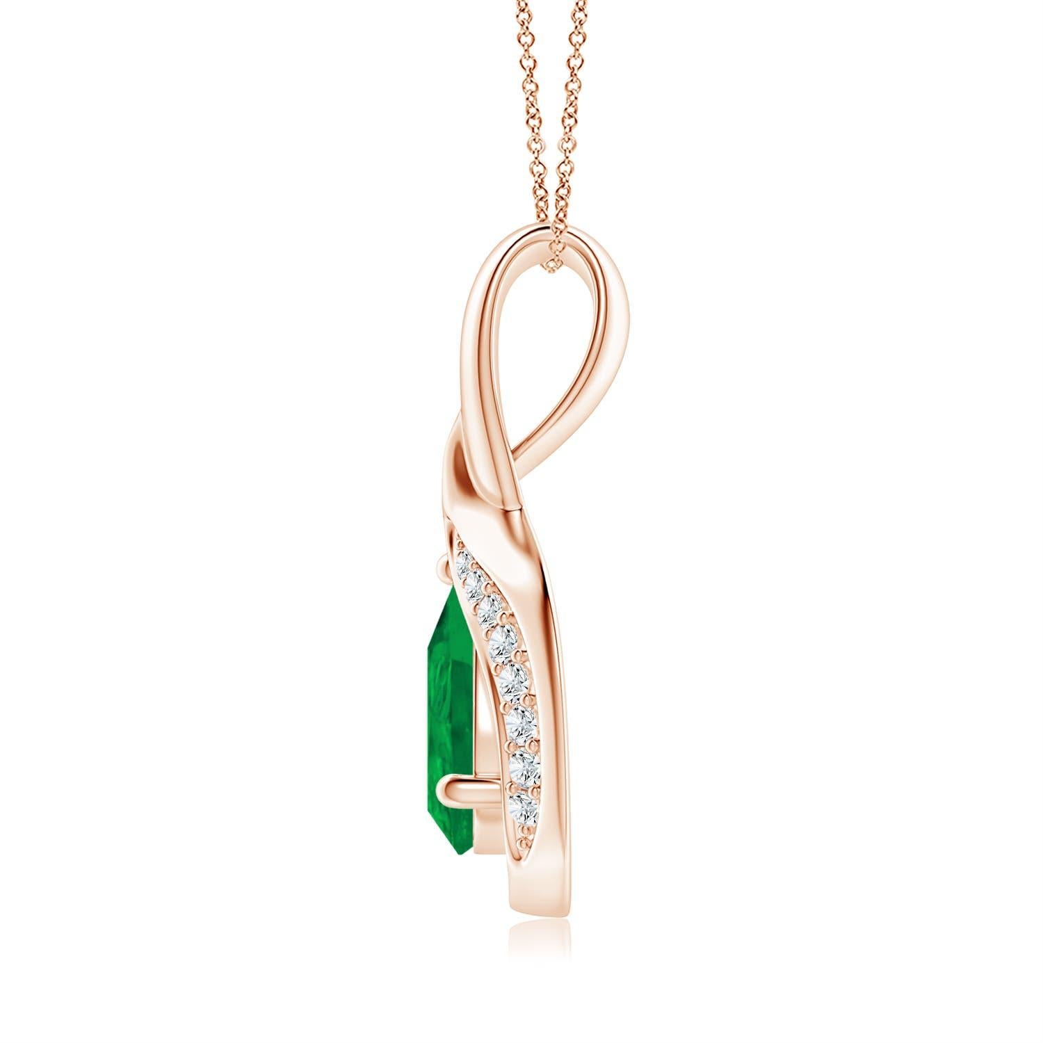 Lo smeraldo a forma di pera è incorniciato da un bellissimo anello di metallo lucido a forma di goccia. Scintillanti diamanti incastonati ornano la curva per un bordo scintillante. Questo splendido pendente con smeraldo e diamante in oro rosa 14k ti