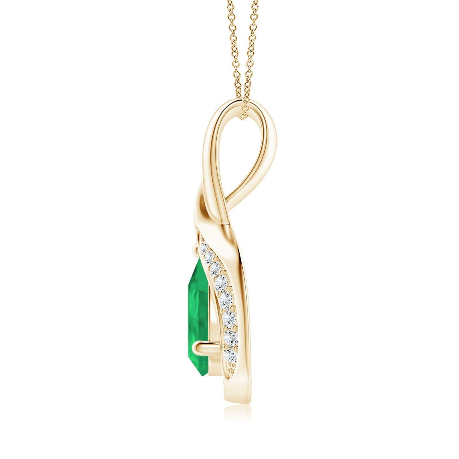Lo smeraldo a forma di pera è incorniciato da un bellissimo anello di metallo lucido a forma di goccia. Scintillanti diamanti incastonati ornano la curva per un bordo scintillante. Questo splendido pendente con smeraldo e diamante in oro giallo 14k