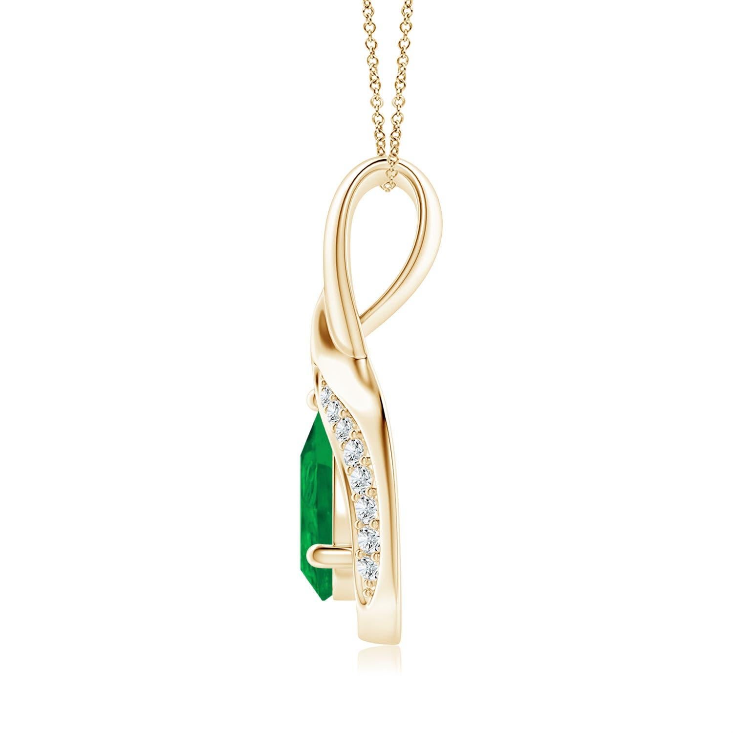 Lo smeraldo a forma di pera è incorniciato da un bellissimo anello di metallo lucido a forma di goccia. Scintillanti diamanti incastonati ornano la curva per un bordo scintillante. Questo splendido pendente con smeraldo e diamante in oro giallo 14k