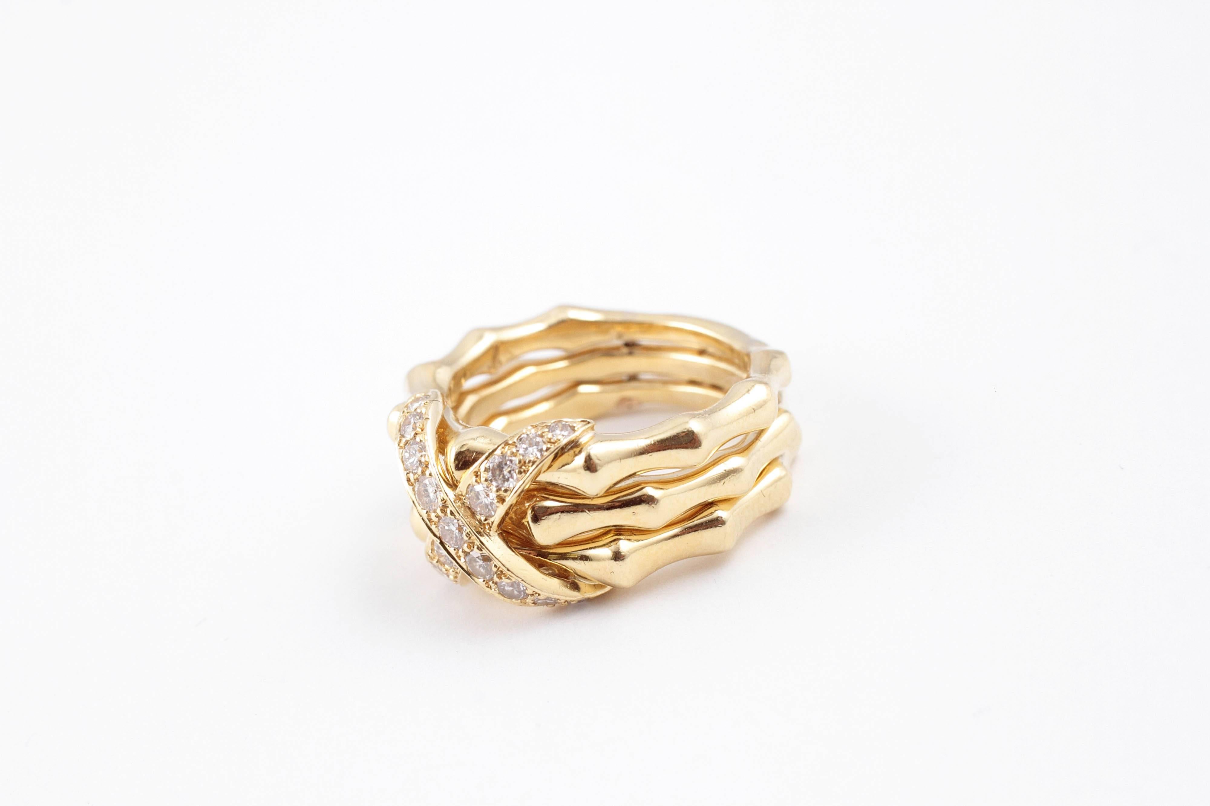 Highly polished 18 karat yellow gold bamboo ring with 1/2 carat of diamonds encrusted in a stylish X, in size 6 1/2.