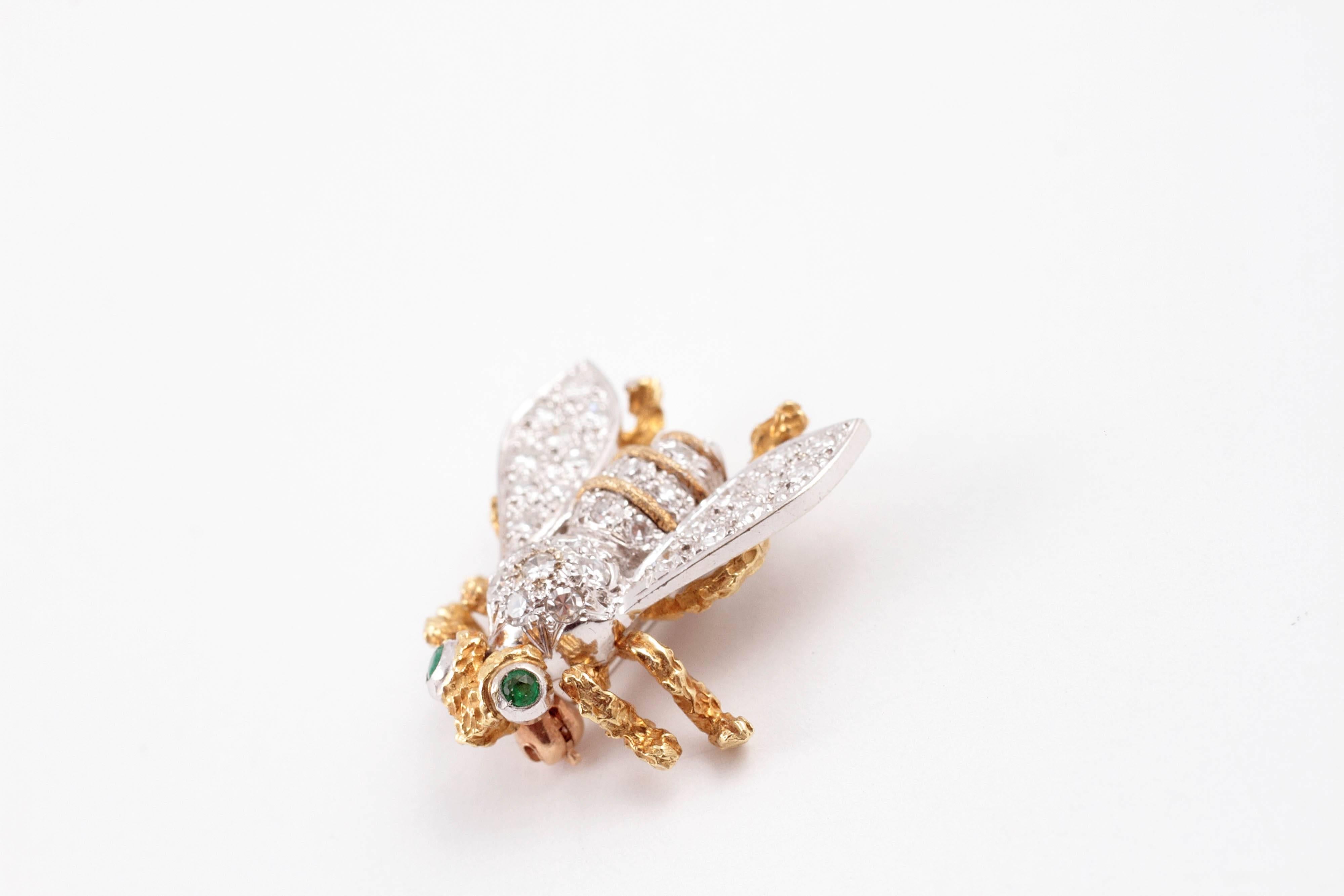 For the collector of brooches!  In 18 karat yellow and white gold, set with 0.50 cts of single-cut, round diamonds in the body and bezel-set, emerald eyes, secured with a straight pin clasp.  Diamonds are estimated to be SI in clarity and H - I in