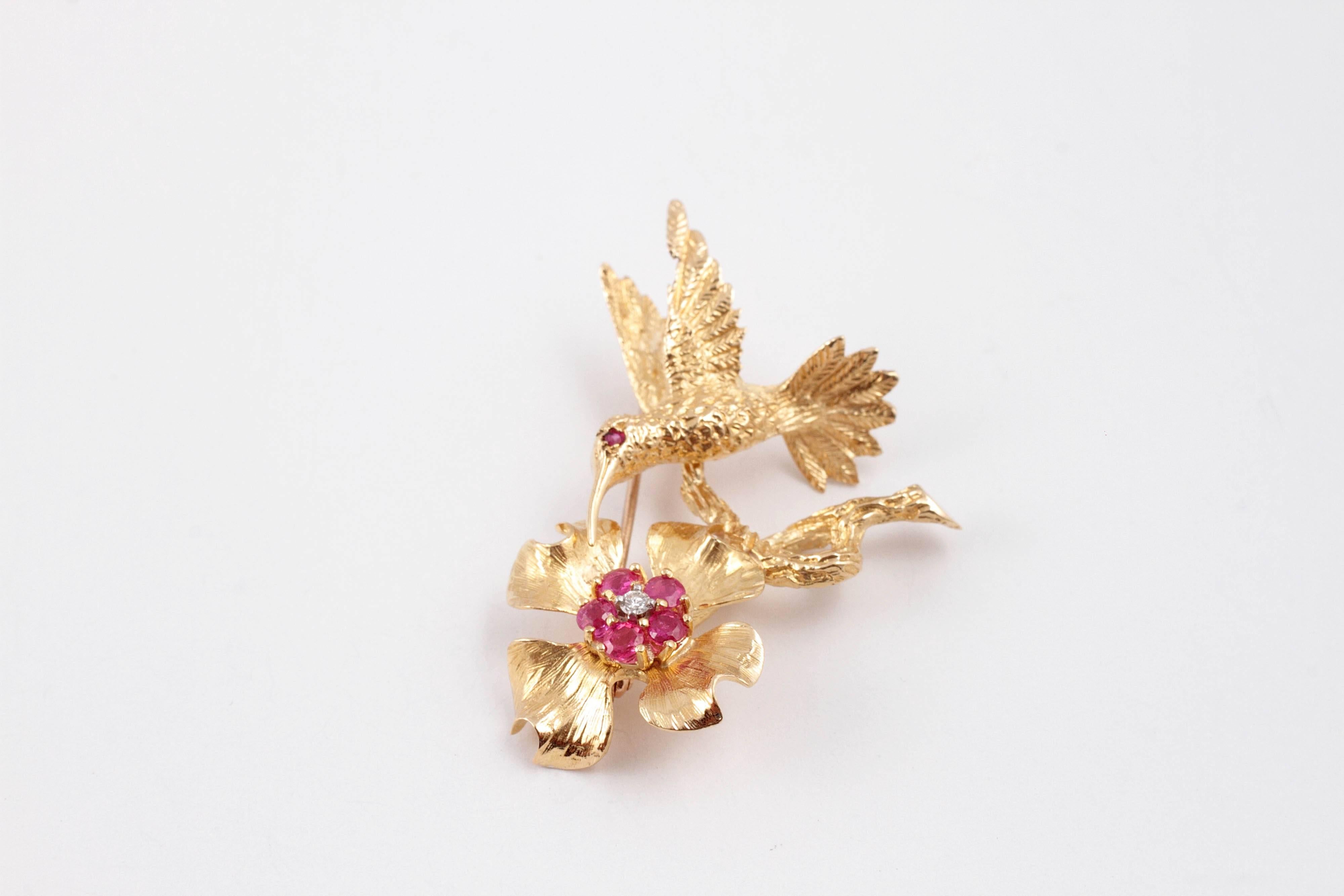 This captures the fanciful flight of a hummingbird! Burma rubies surround an accent diamond, Almost 1 1/2 inches in length.