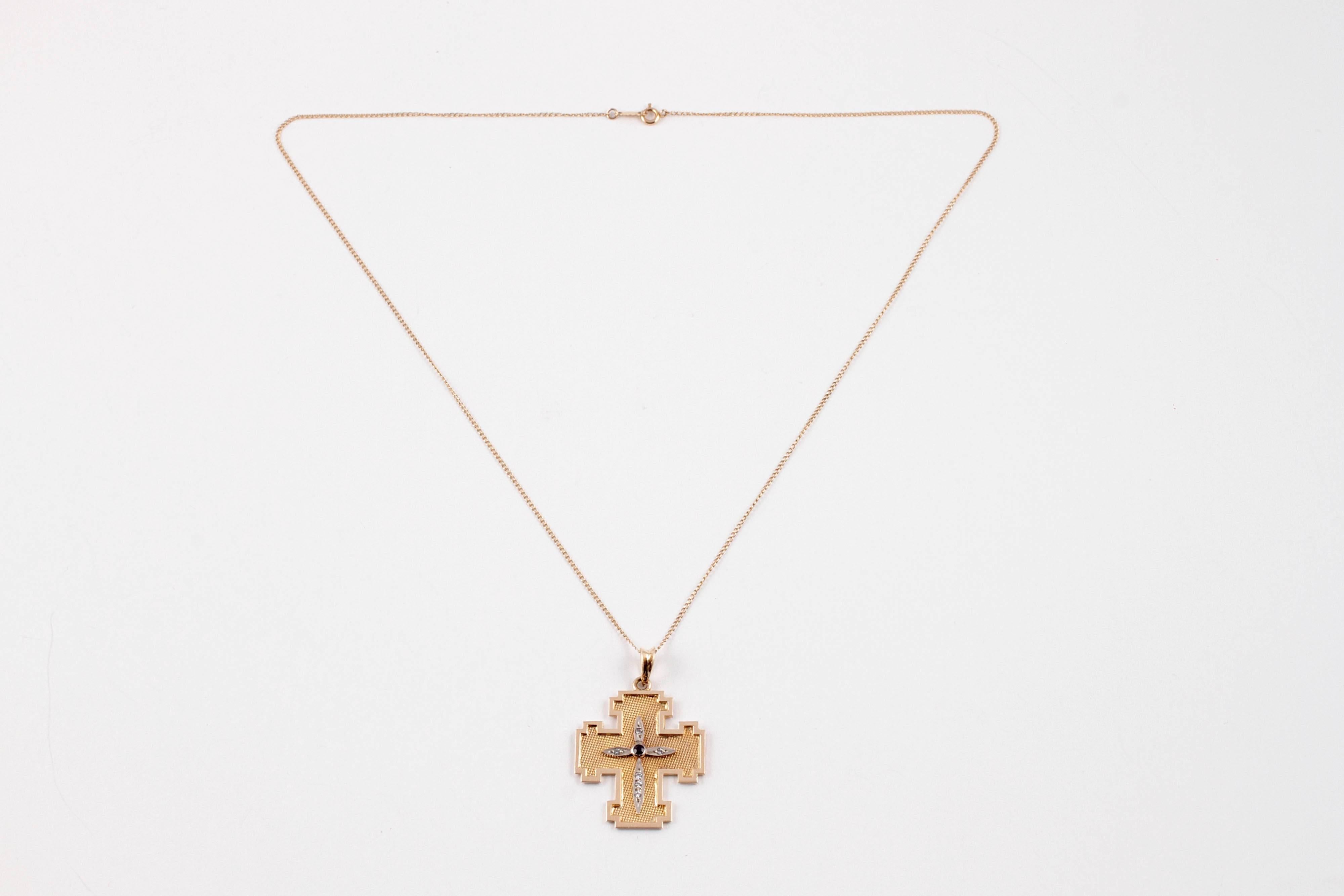 For a cross necklace that is a little out of the ordinary - pick this one!  In 14 karat yellow gold with a sapphire and simulated diamonds.  The chain is 18 inches in length and the pendant is 1 1/2 inches in length.
