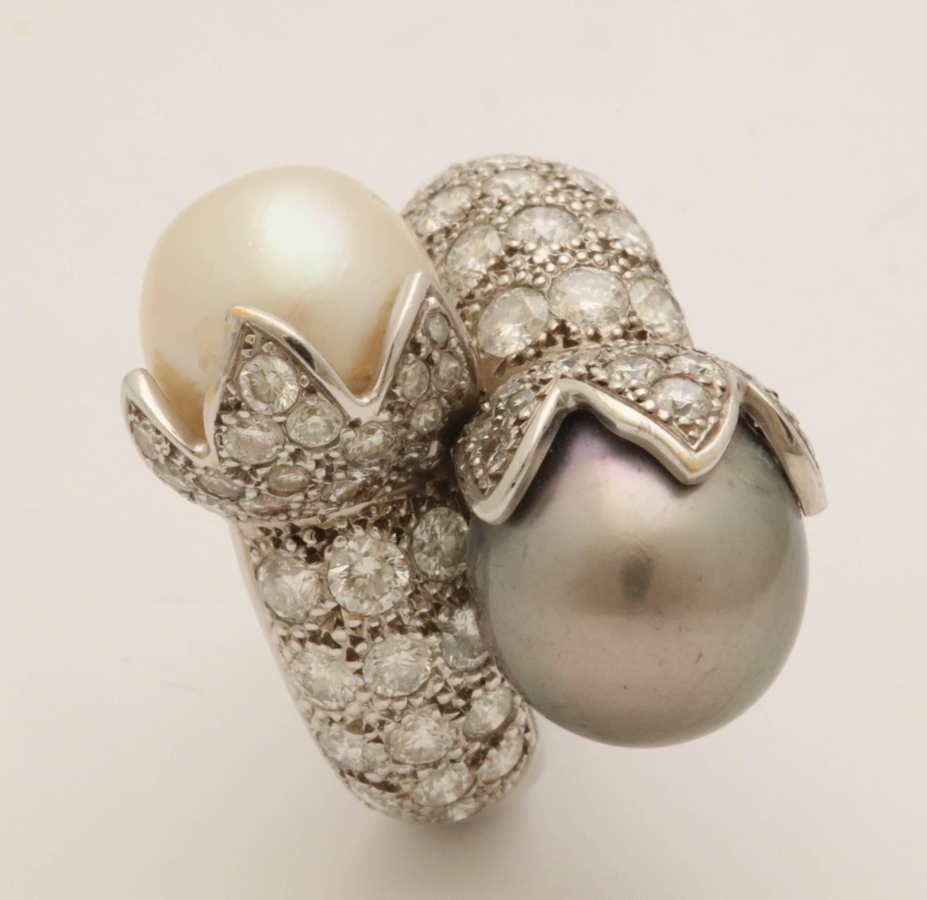 One Ladies White Gold Double Crossover Bypass Cocktail Ring Embellished With One Cultured Pearl Measuring Approximately 11Mm And One Grey Silver Tahitian Pearl Measuring approximately 12Mm . Bypass Cocktail Ring Is Further embellished With Numerous