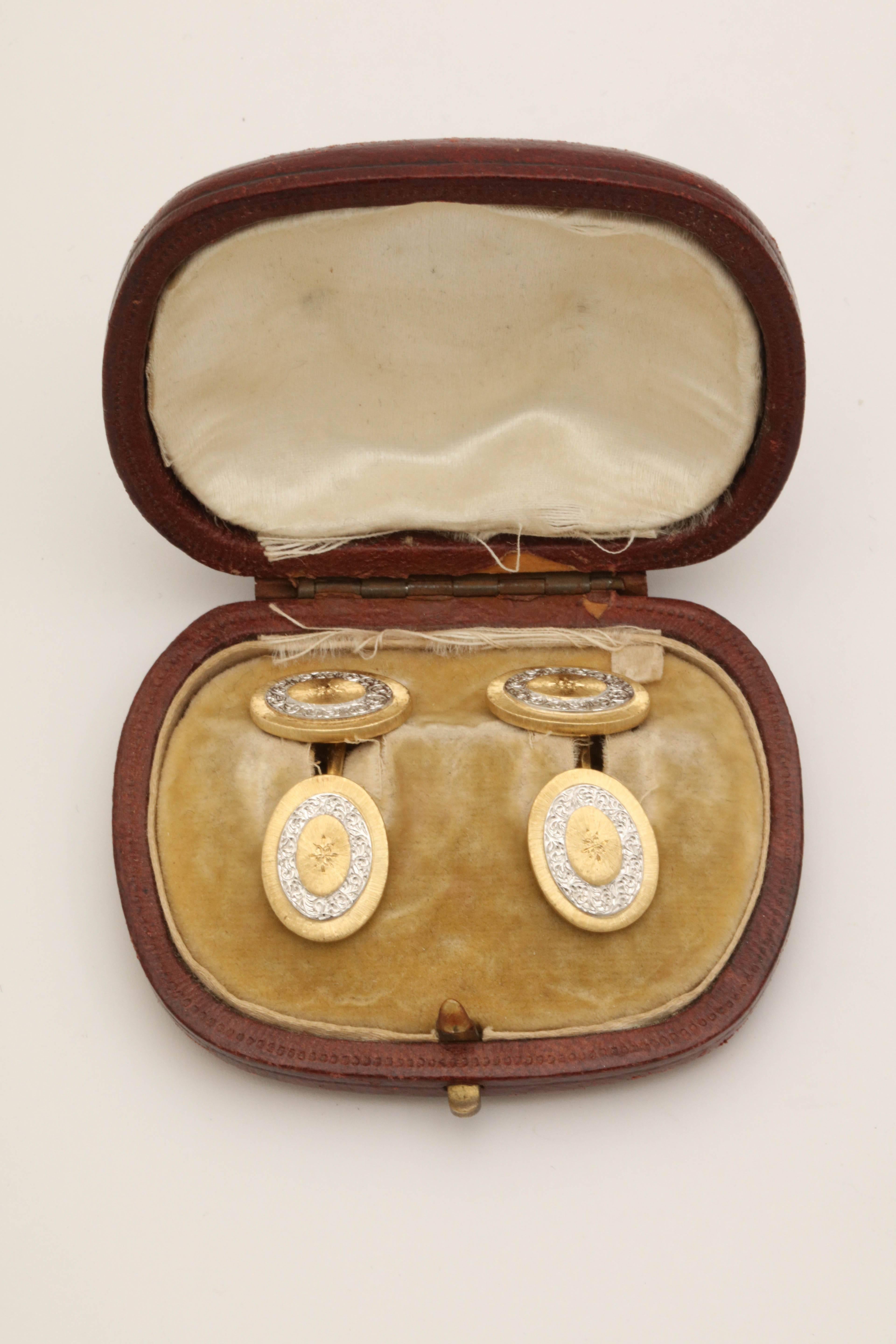 One Pair Of Gentleman's Double Sided Oval Shaped White And Yellow 18kt Gold Cufflinks With a Hand Engraving White Gold Pattern In Center Of Cufflinks And A Yellow Gold Florentine Finish design Pattern Signed Mario Buccellati And Designed In The