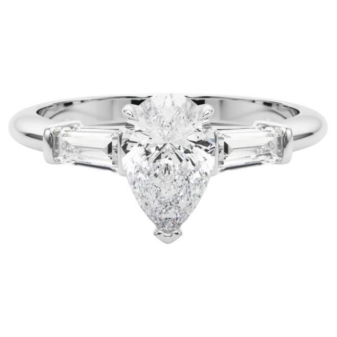 Anillo de diamantes de tres piedras pera y baguette de 1,00 quilate certificado por GIA