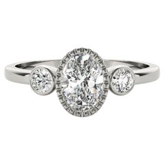 GIA 1.20 Carat Oval Textured Bezel Three-Stone 18K White Gold Diamond Ring