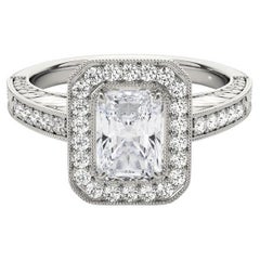 Anillo de diamantes en platino calado con halo radiante grabado y certificado GIA de 2.01 quilates