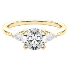 GIA Certified 1.3 Carat Round 
Pear Three-Stone 18K Yellow Gold Diamond Ring