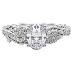GIA 1.01 Carat Oval Three-Stone Curved Bypass Diamond Ring