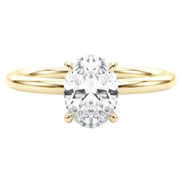 Bague en or jaune 18 carats certifiée GIA et ornée d
un halo caché ovale de 2 carats