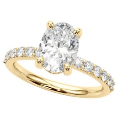 Anello con diamante solitario ovale e canale con punte di 1.22 carati certificato GIA