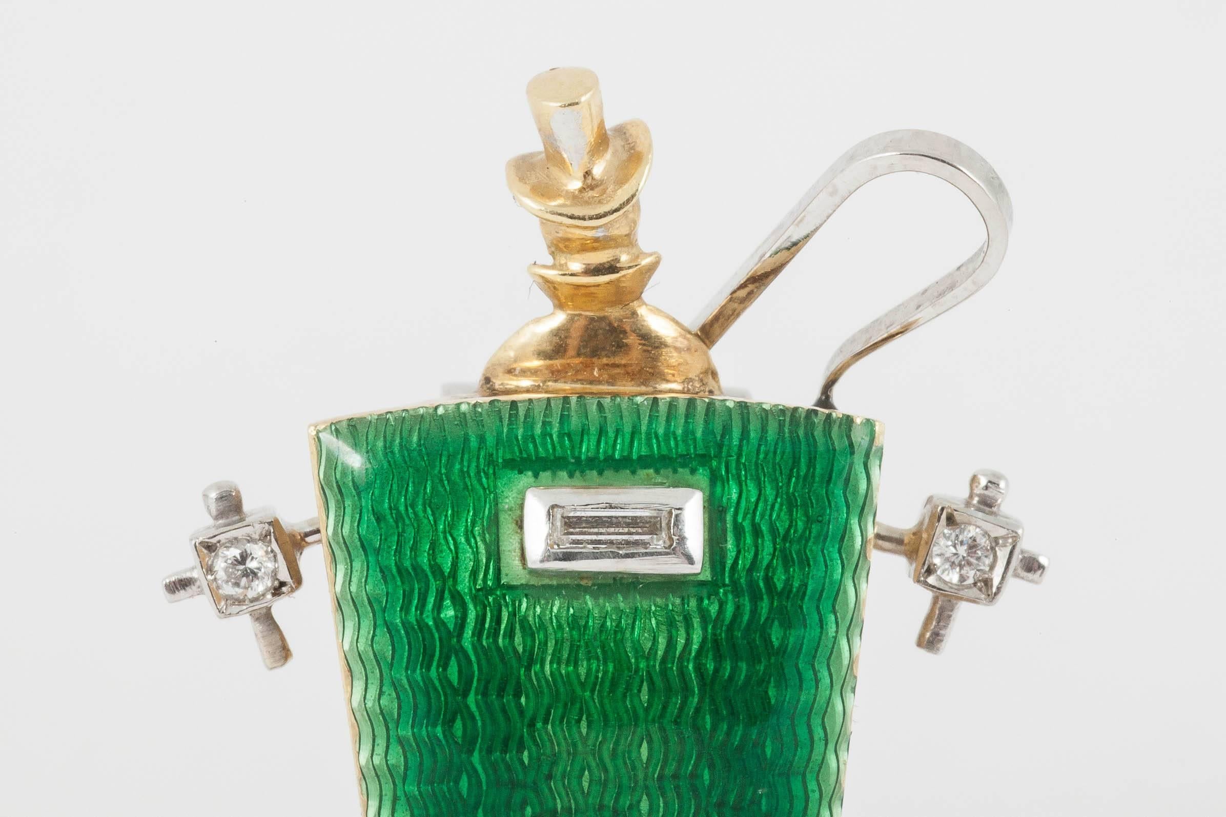 A fine quality, 18kt yellow and white gold coaching carriage clip brooch with guilloche green enamel , and set with a single, baguette cut diamond and four sapphires. French import mark. The driver carrying a whip, the coach lamps set with a single