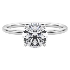 Bague à diamant en platine certifiée GIA de 1.51 carat avec halo caché et solitaire rond